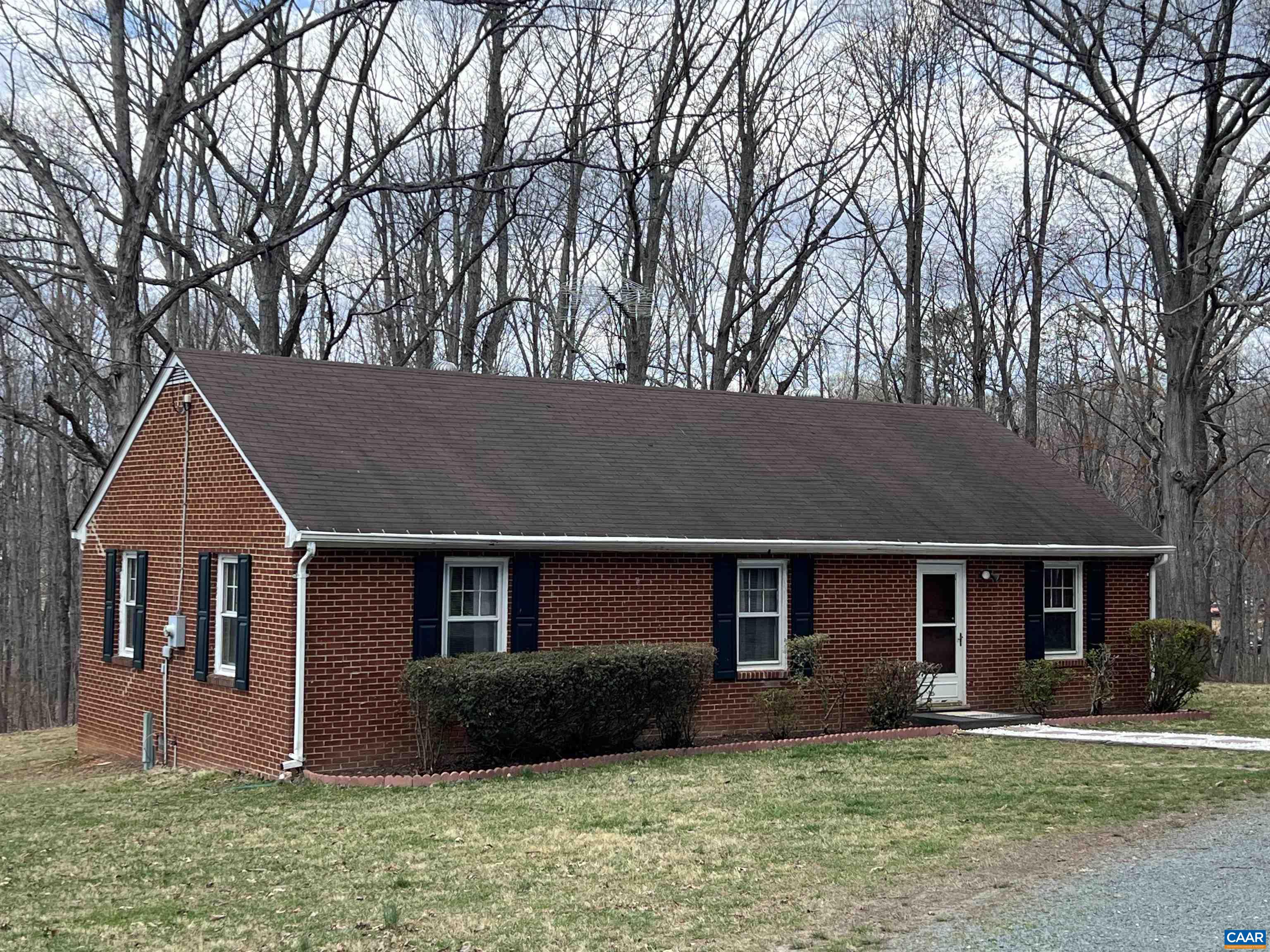 Lovely country 3 bedroom brick home in Southern Albemarle County area of Woodridge.  Solid built home on 5+/- rolling acres w/ garden spot, 3 storage buildings, chicken coop, open field, and woods.  Wood floors under carpet in bedroom similar to living room wood floor according to seller.  Being sold by Court Order to settle an estate.  Value and prime location priced to sell in today's market.