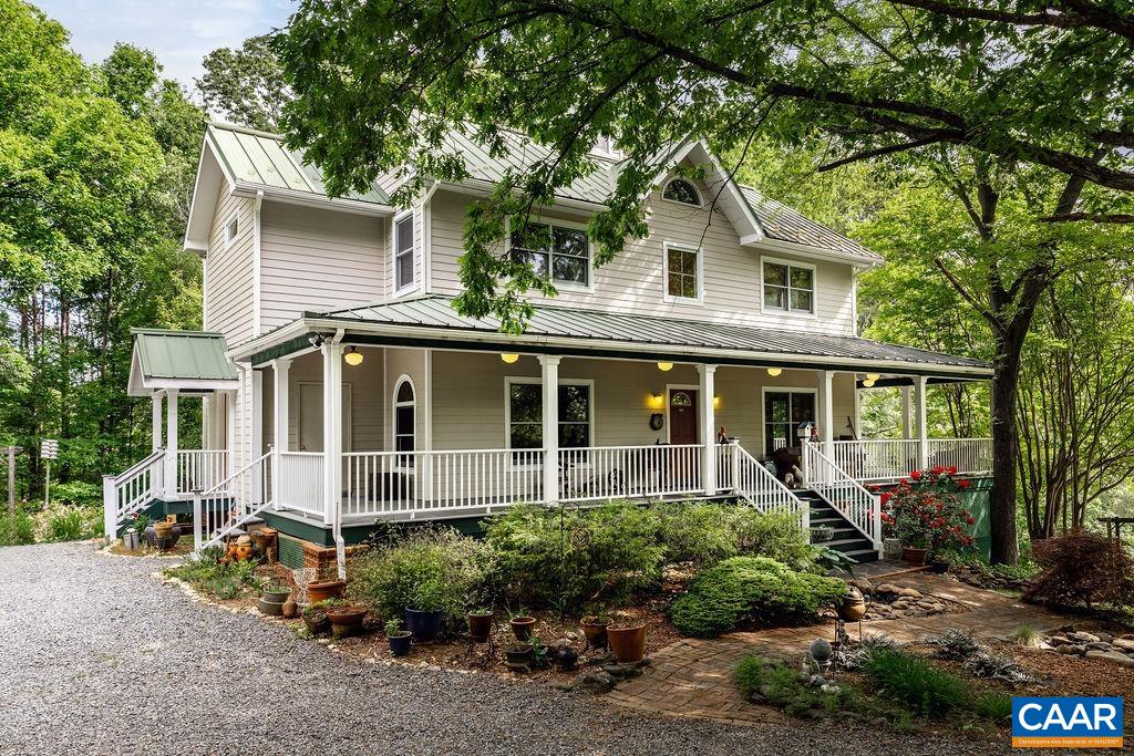 Welcome to Rooster Hill! Custom built 5 bedroom home on nearly 6 acres w/ mountain views located in the foothills of the Blue Ridge Mountains.  The modern farmhouse exterior has a wide wrap around covered porch - perfect for enjoying the property. Inside the house are 5 spacious bedrooms, 4.5 baths spanning over 3600 sq ft. The 2 first-level bedrooms each have their own kitchenettes, bathrooms, entrances, parking, & outdoor space. Special Features include: energy-efficient solar power w/ 40 panels & a solar generator; 1 gig fiber internet access; spacious kitchen w/ quartz countertops; 2 walk-in pantries; solid oak hardwood floors; soapstone hearth & trim accents throughout home; custom built-in wall units, cabinets & closets; standing seam metal roof; EV charging station; walk-in roof top cupola; massive attic storage. The property also includes a separate workshop, greenhouse, fenced veggie garden, & adorable chicken coop. Great Western Albemarle school district. Convenient to Charlottesville, UVA, Crozet, shopping, local restaurants & schools. Enjoy the income potential by renting the 2 first-level rooms as these owners have, or make a family compound. Purchase the adjoining acreage & rental home for more income or space.