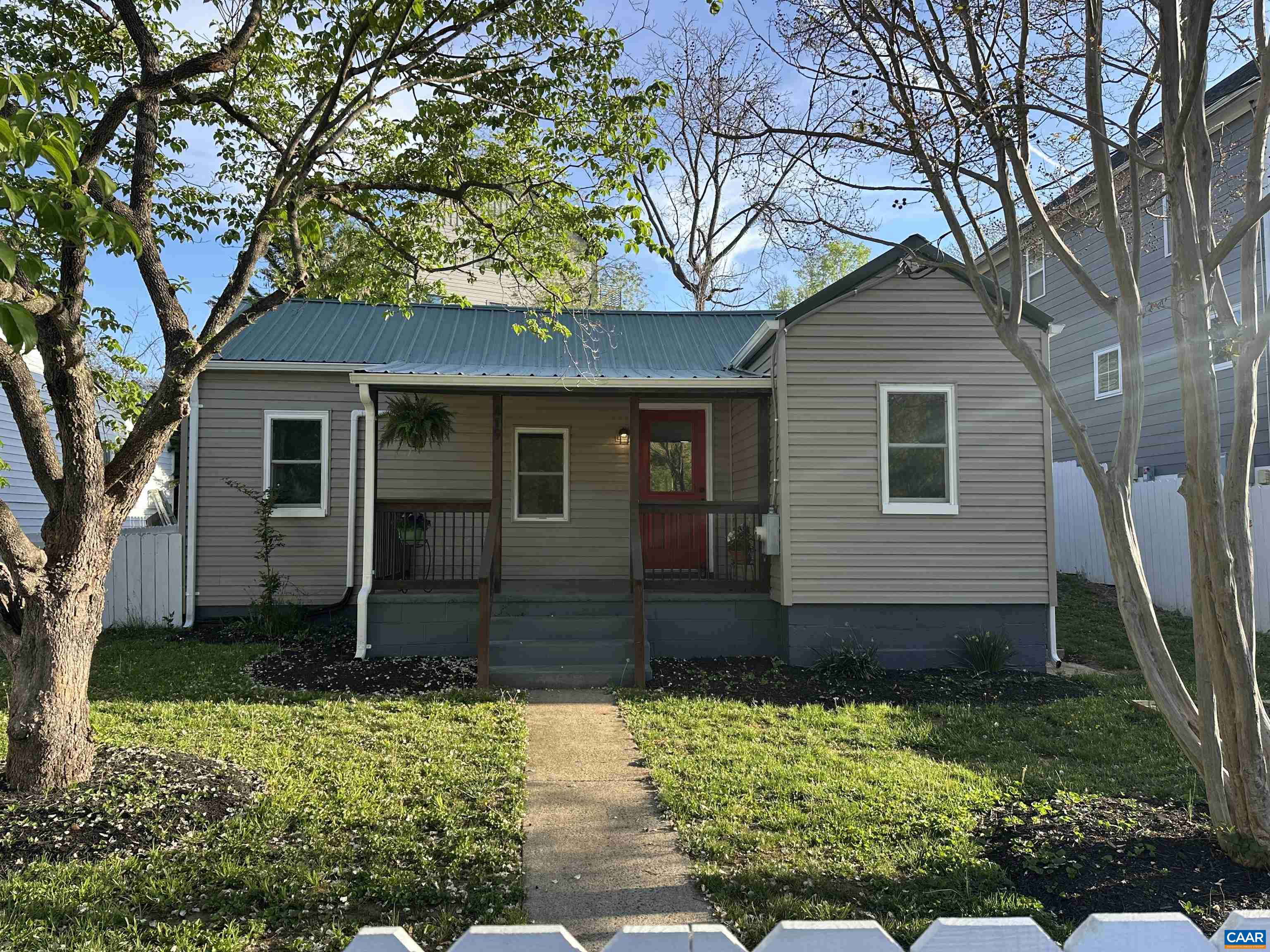 This sweet little cottage in the heart of Belmont packs a punch!  Right across the street from Quarry Park, just 1 mile to the Downtown Mall, minutes to UVA, and around the corner from I64, it's a great location! You will adore the white picket fence the surrounds the front yard, and the covered front porch where you'll enjoy the view of Carter Mountain and watch baseball games right across the street.  The new metal roof adds to the charming exterior style and vintage flair.  Inside, the home has been completely renovated and features modern conveniences throughout.  New white shaker cabinets are found in the kitchen plus sleek stainless appliances, and a large tiled shower in the bathroom. Ductless HVAC system was added for heating and cooling. There’s even a spacious mudroom off the back with a sliding barn door. At 850 square feet, it's cozy but smartly laid out with 2 bedrooms plus an office.  If you're looking for an affordable, low-maintenance, move-in ready home in a fantastic location, this one's got the charm and the updates to match. Don't miss this opportunity to see this one before its gone!