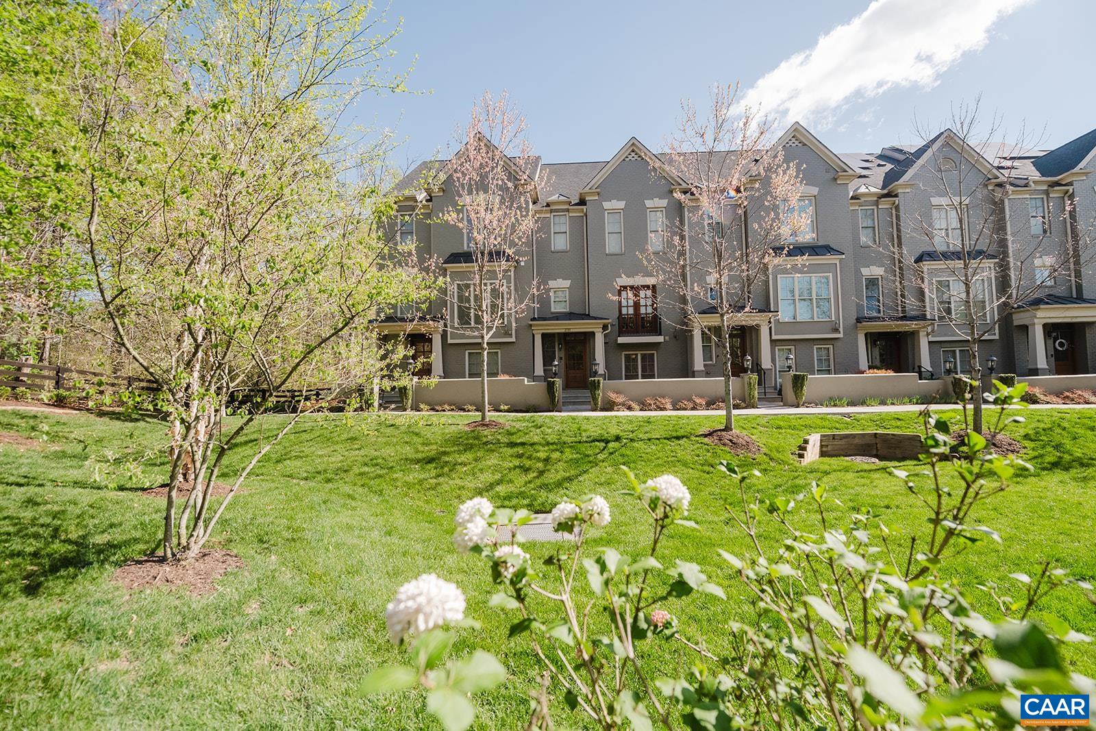 Nestled in the quiet corner, this Out of Bounds townhome is elegantly appointed and overflowing with upgrades throughout. Greeted by a beautiful green space upon your arrival, this light filled and airy townhome makes the most of its outdoor spaces and includes both a large screened porch as well as a private rooftop veranda w/grill gas hookup.The main level floor plan is perfect for entertaining with its spacious kitchen flowing seamlessly into the living room and porch, while the third floor features a spacious owner's suite with two walk-in closets, a second bedroom with a private bathroom and a laundry room. The top level boasts a large room and full bath, wet bar with fridge and the private veranda and is ideal for another luxury bedroom or studio/office/family entertainment space. Special features include a gourmet kitchen, oversized island, white cabinetry, dual fuel range, quartz and wood countertops, custom built-ins, walnut flooring, mudroom, tray ceilings, customized lighting/fans, walk-in attic with generous storage, 2 car garage and an elevator that serves all four floors for stair free living. Conveniently located just minutes away from Barracks Rd Shopping, UVA and Historic Downtown Charlottesville.
