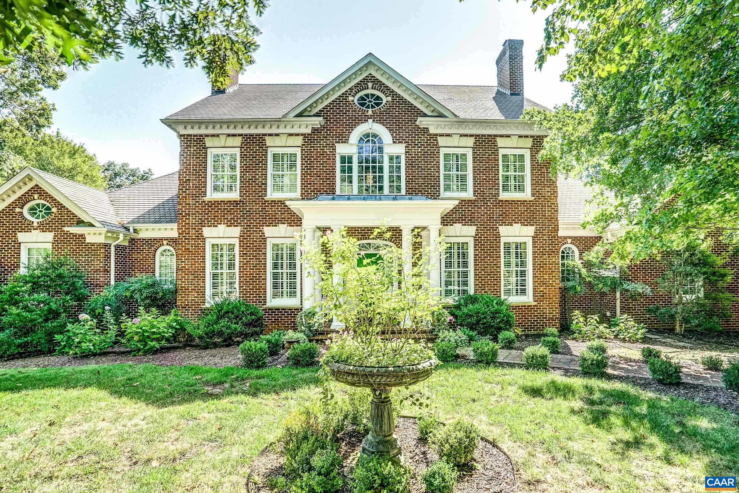 Nestled at the end of a peaceful cul-de-sac, this magnificent Georgian brick estate offers the perfect blend of elegance, comfort, and modern convenience. Overlooking the 16th and 17th holes of Glenmore's golf course, the home features timeless design and exceptional craftsmanship. The spacious two-story family room, with soaring ceilings and expansive windows, creates an open, serene atmosphere. The chef’s kitchen, with a large island and top-tier appliances, is ideal for preparing gourmet meals and entertaining guests. Three beautiful fireplaces and a large terrace offer luxury and comfort for both relaxation and gatherings. The formal dining room and living room/library are perfect for intimate or grand events. The main floor primary bedroom suite features a cozy sitting area and fireplace, while the second floor includes three additional bedrooms, a loft, and ample natural light. The terrace level boasts a home office, game room, family room, and private bedroom with full bath. Located in the Glenmore Community, this offers amenities like walking paths, rec field, clubhouse, golf, tennis, paddle tennis, platform tennis, fitness and more. Experience luxury living located minutes from Hospitals, UVA, Airport & Charlottesville.
