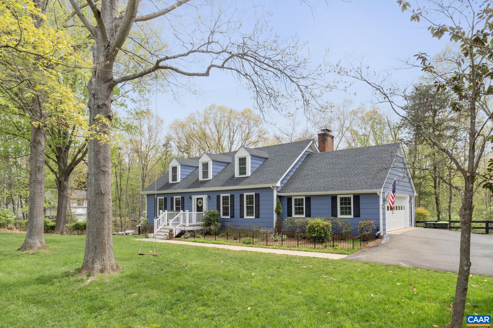 Welcome to this beautifully updated 4 bedroom, 3.5 bath Cape Cod home in the sought-after Western Albemarle School District. On 1.25 private acres, this move-in ready home blends the best of rural living with convenient access to both Charlottesville and Crozet. Fully fenced backyard featuring a hammock, rope swing, fenced garden area, and a large chicken coop complete with 11 chickens! Terraced gardens await your spring planting and a spacious open area with firepit invites gatherings. Enjoy the outdoors nearly year-round from the oversized deck and screened-in porch. Inside, the home offers plenty of light-filled space to host and entertain. Fully finished basement is perfect for guests, complete with a bedroom, full bath, and two living areas. Ample storage that includes two dedicated storage rooms in the basement and clever knee wall storage upstairs. The neighborhood is a nature lover’s dream. Take a scenic 3-mile walk through a nature trail to Lake Albemarle-a 36-acre public fishing lake with a boat ramp & breathtaking mountain views. Enjoy Knight’s Gambit Vineyard, hiking/swimming at Sugar Hollow Reservoir, and Wyant’s Country Store. Located just 15 minutes from Barracks Road Shopping Center & downtown Crozet! owner/agent