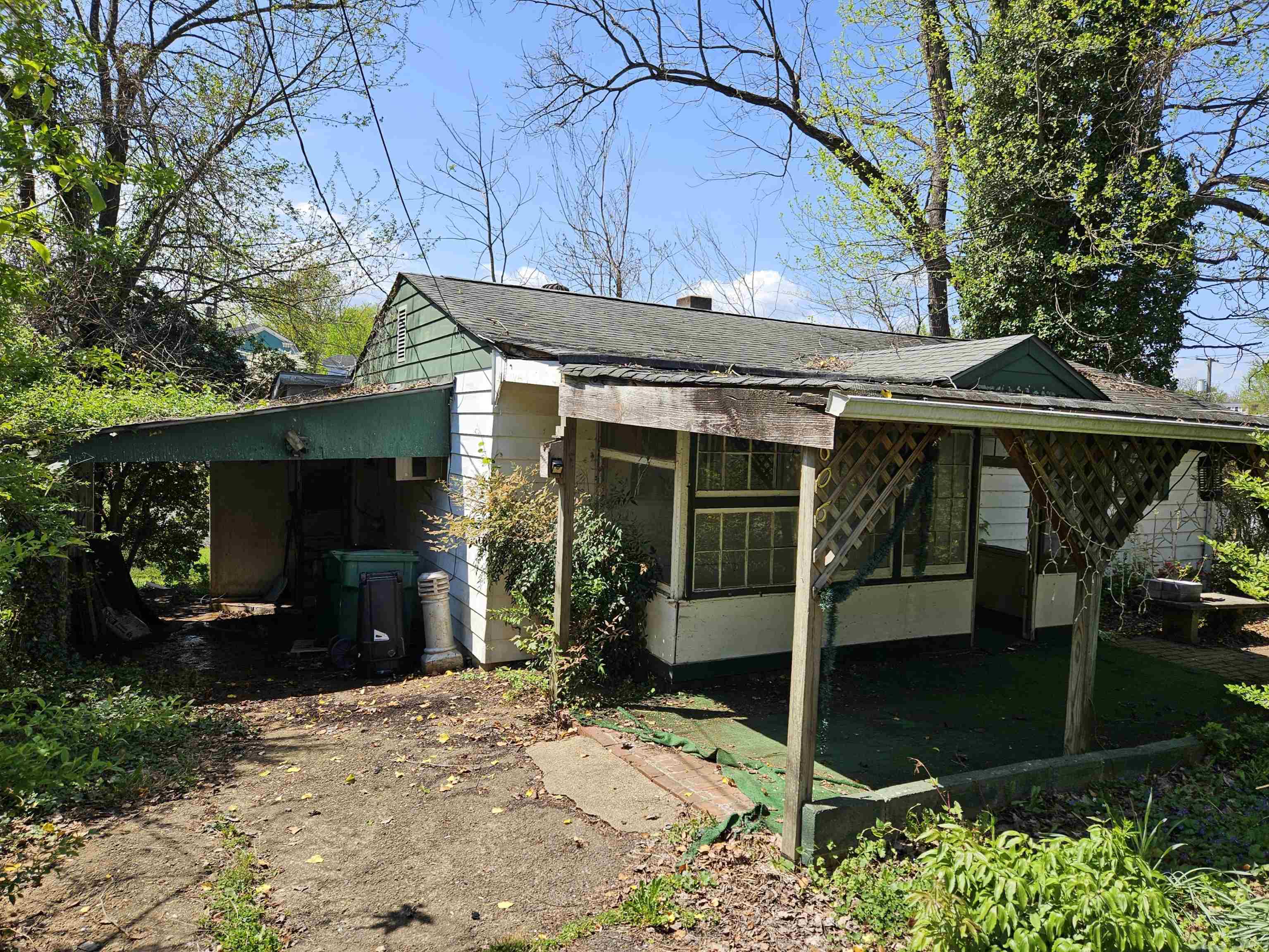 Opportunity is calling - priced below assessed value!! Calling all investors, DIYers, and contractors! Location, location, location!! Moments away from dining, shopping and more. Walk to dinner! This house is in need of good bit of TLC. Bring your imagination and make this a great investment right in the heart of Charlottesville. Currently configured as a 2 bedroom 1 bathroom home, the addition of a 3rd bedroom could provide a great return on investment. Call your local Realtor to tour today! Sold As-is.