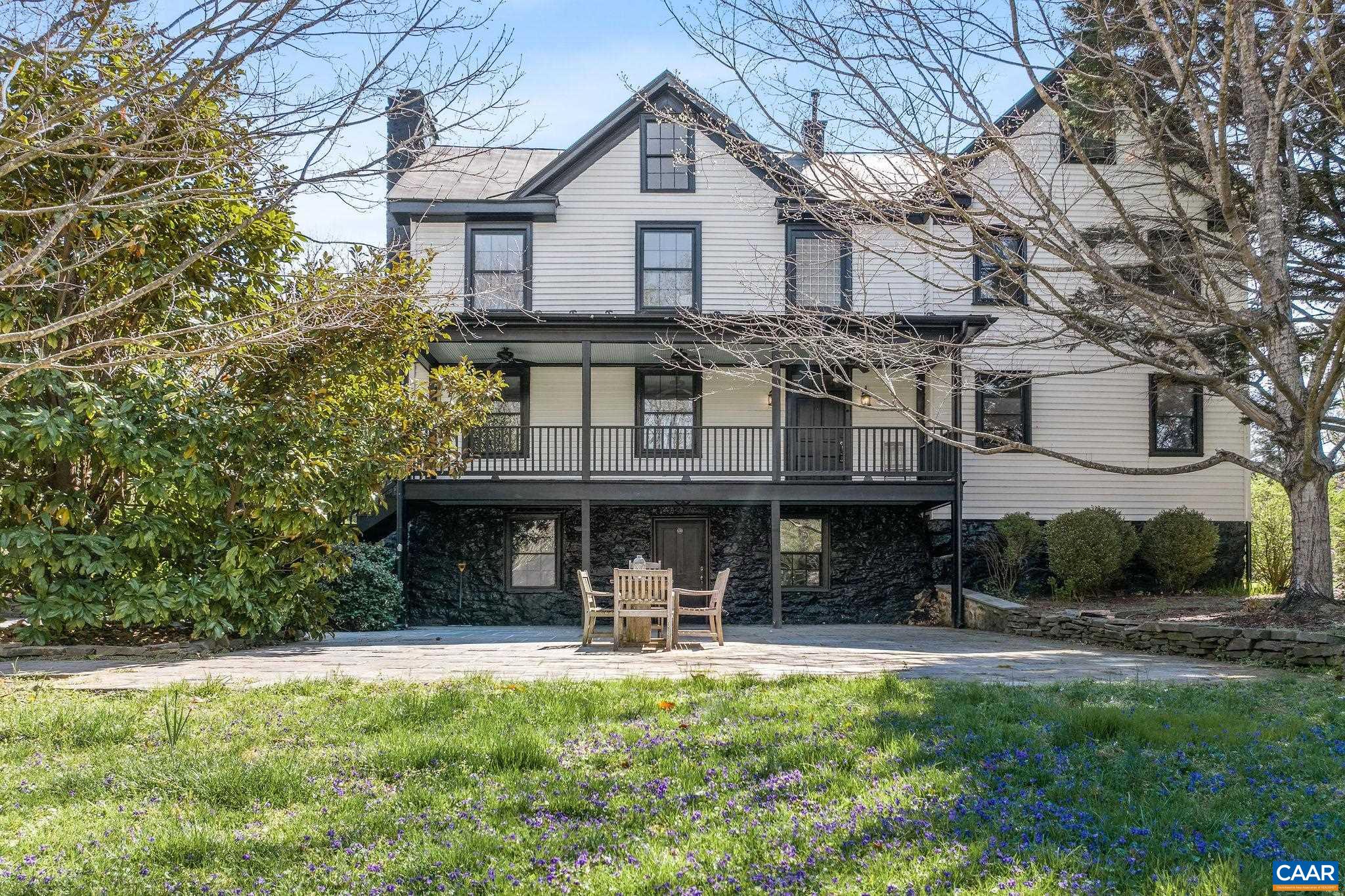 This prominent Historic property built in 1800 was at one time a civil war general store is set on 6.86 private and tranquil acres with a small stream that meanders through the property. This classic home has been comprehensively renovated making it a very distinguished residence. The interior boasts antique beams, vaulted ceilings, 5 stone fireplaces, beautiful hardwood floors & moldings. The exterior and outdoor spaces include large porches, a bluestone courtyard. In addition to the main house is also a beautiful, large and very charming “log cabin style” guest house that can also be used for various purposes (built as a music studio). Located 10 miles south of Charlottesville and within minutes to vineries and restaurants. MLS# 663188