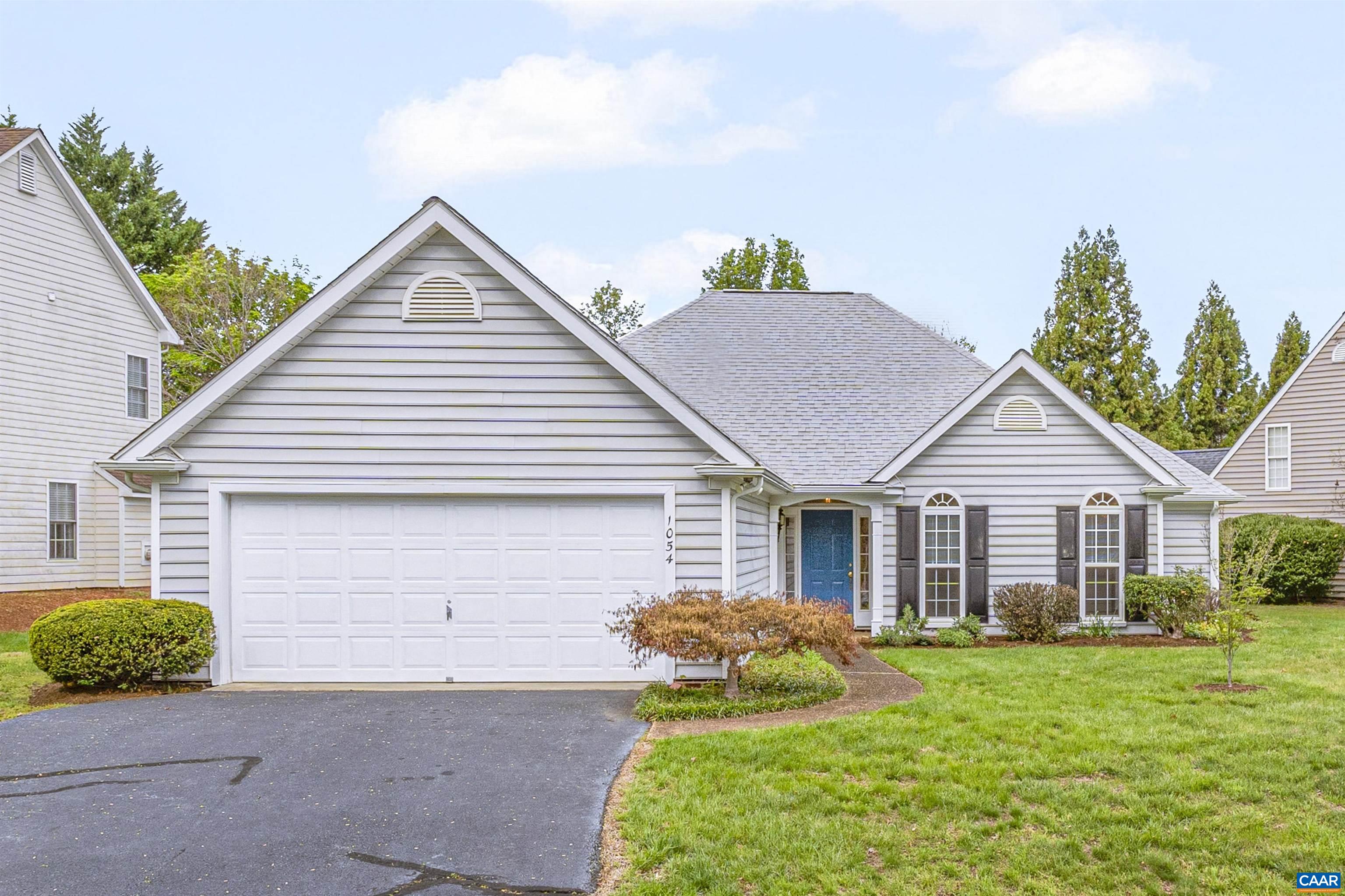 Welcome to this light-filled, one-level home offering timeless appeal, a functional layout, and the opportunity to make it your own in the Western Ridge community. You'll find with the vaulted-ceiling living room and family room, there’s space to spread out, relax, and enjoy the best of single-story living. Inside, you’ll find large windows throughout that bring in beautiful natural light, highlighting the hardwood and luxury vinyl plank flooring—no carpet in sight. The generously sized kitchen and main living spaces offer great bones and a flowing floor plan, ready for your personal touch and vision.  A true highlight is the sun-drenched sunroom, an ideal spot to enjoy your morning coffee or a peaceful moment with views of the vibrant backyard. Step outside into a mature, organically maintained yard where spring brings a delightful array of surprises—perennials, daffodils, blueberry bushes, and blooming David Austin roses create a living landscape that’s as beautiful as it is bountiful. Gardeners and nature lovers alike will appreciate the care and love poured into this outdoor space. This sweet neighborhood enjoys a pool, sports court, fitness gym, clubhouse, playground, mountain views and more!