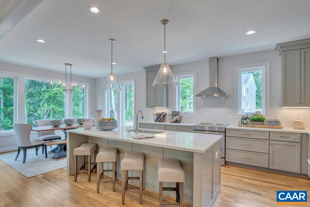 New Construction Keller Grand plan on 2 wooded acres in Northern Albemarle, just minutes to shopping and the airport with no HOA!  This open concept, light filled home sits on a private wooded lot just moments for Rt.29.   There is a walkout basement with a back yard that is perfect for a pool, patio or garden. Enjoy entertaining in the open kitchen with oversized island and huge pantry.  Features include but are not limited to: a rear screened porch, tray ceilings, large kitchen with center island, Pella windows and real white oak flooring.   Enjoy all your main living in one open and airy space.  There is a generous master bedroom featuring an on-suite bath with a walk-in closet.  Images are from similar models previously built.  This is a new plan, so no images of this exact floor plan exist yet.
