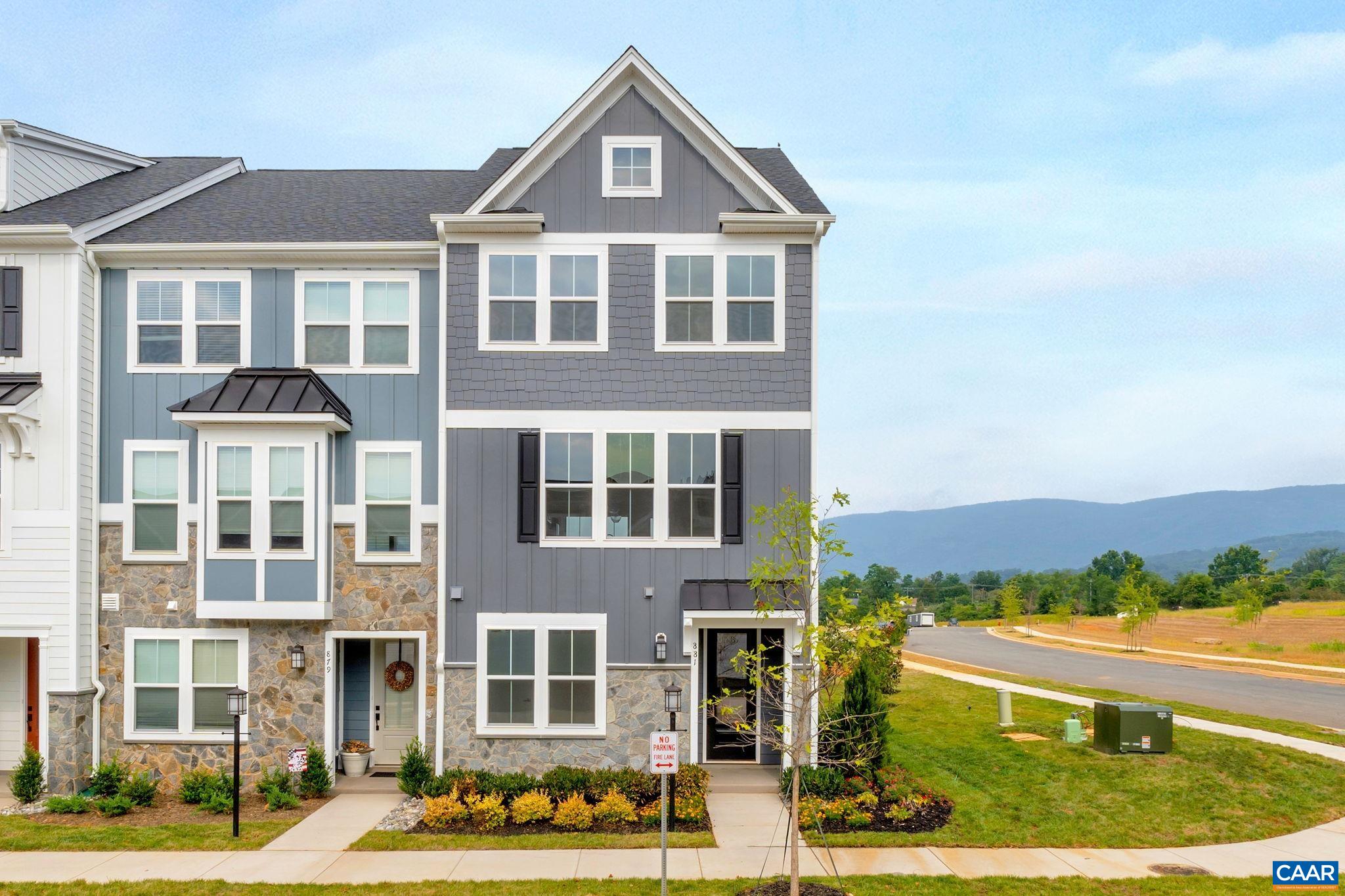 Discover the Holly II, a beautifully designed three-story townhome in the newest section of Belvedere. Fall '25 completion! This stunning home offers a spacious and flexible layout, starting with a rec room and half bathroom on the first floor, perfect for a gym, office, playroom or den. The second floor’s open-concept design features a large kitchen with a walk-in pantry, a generous dining area, and a sunlit family room, ideal for entertaining or everyday living, plus an additional half bath. Upstairs, the primary suite provides a retreat with a luxurious en suite bath, while two additional bedrooms share a well-appointed hall bath. The laundry is conveniently located on the third floor, making household tasks a breeze. Thoughtful upgrades like oak stairs with open railings and gas appliances add both style and functionality. A rear two-car garage offers parking and extra storage.  Belvedere offers an array of amenities, including access to parks, close proximity to the Rivanna trailhead, the nearby SOCA Fieldhouse, a dedicated dog park for pet owners, and enchanting playground areas.  Photos are of similar home and may show optional upgrades.