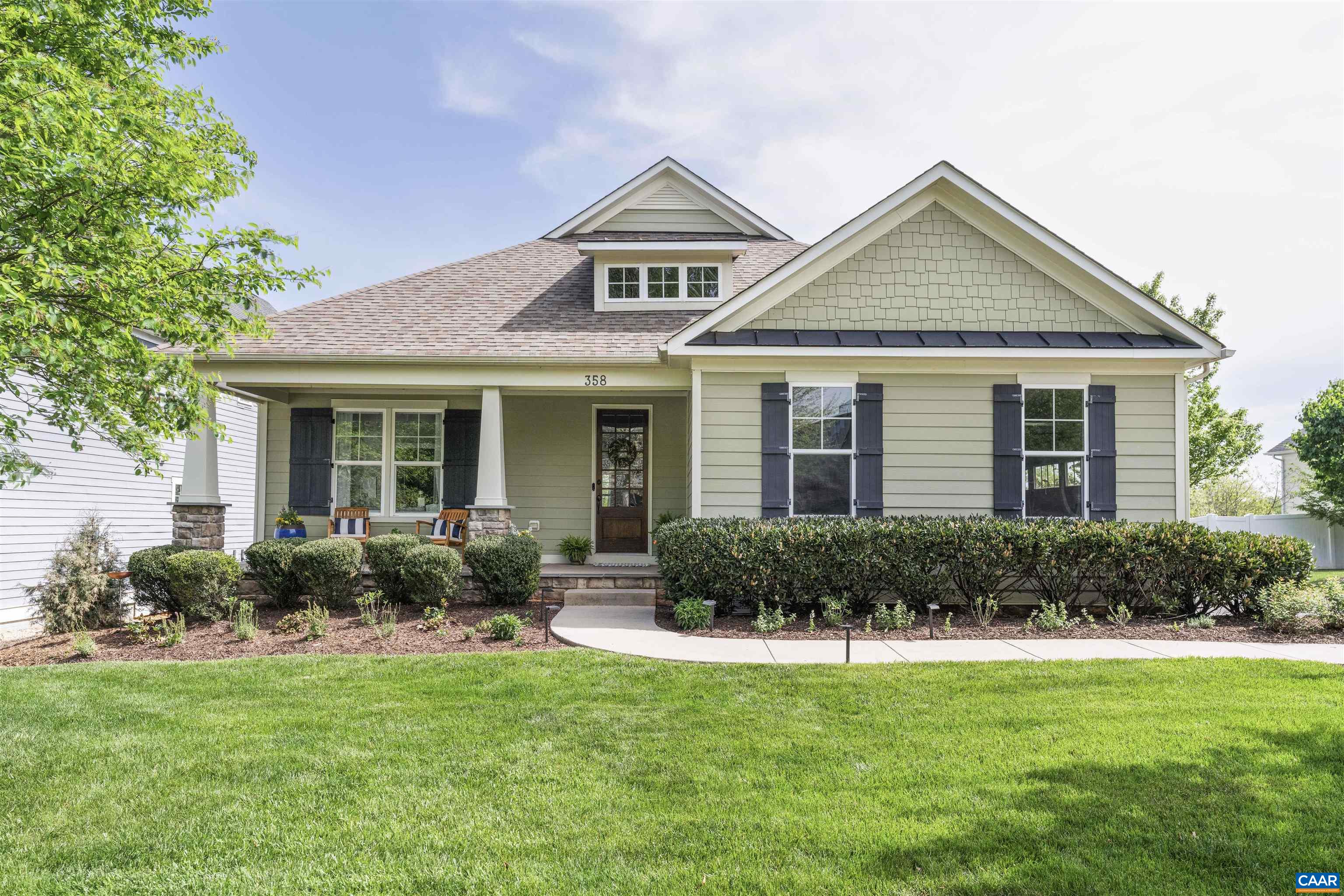 OPEN HOUSE Sunday 4/27 12pm-2pm. Enjoy the best of both town and trail in this ideally located home with expansive mountain views and direct access to the trail system. Just a short walk to the local coffee shop, restaurants, ACAC fitness center, and the community pool, this home offers true main-level living with flexible space for guests. The main level includes three bedrooms, including the primary suite, a kitchen with breakfast nook, dining room, and laundry room. The open living space is anchored by a dual-sided fireplace that connects the great room to a screened porch overlooking green space and the mountains beyond. Upstairs, a guest suite and large bonus room create a quiet retreat for visitors. The fully finished basement, completed to custom standards in 2020, includes a spacious rec room, theater with projector and surround sound, bedroom, full bath, custom office with built-in shelving, and an entertaining bar with wine coolers, microwave, dishwasher, and tile backsplash. Whether gathering with friends, relaxing on the porch, or exploring the nearby trails, this home offers space, scenery, and convenience in equal measure.