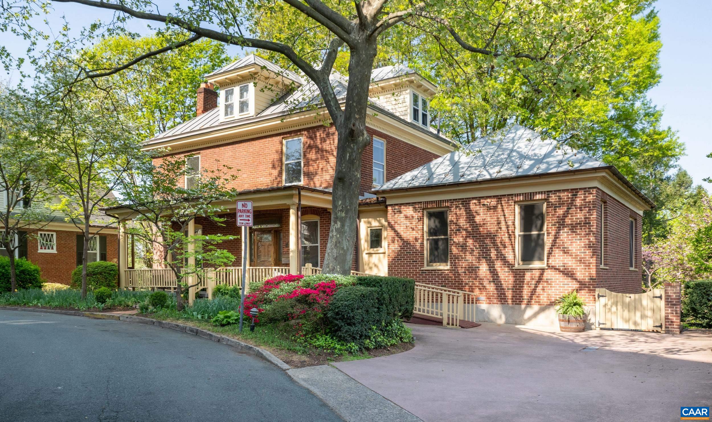 Own a piece of history! Among the most prestigious homes on coveted Altamont Circle on large, landscaped lot, this fine brick residence welcomes visitors w/ an expansive front porch. Step into a grand foyer anchoring the home, leading to LR & DR, each with fireplace, as well as a 21st century lavish Owner’s Suite w/ generously sized BR, 2 WICs & custom bath with soaking tub, separate vanities, zero clearance shower & extra laundry stack. Upstairs find four sizeable BRs, one with its own fireplace, another with a walk-up attic, and another that serves perfectly as a home office and features views of the city. At the rear of the home a kitchen & sunroom open to a deck with covered portico for dining and overlooking the city. Charming, fenced gardens below feature a patio, stone wall & koi pond. The elevated lot shows off a western view of urban landscape, framed by distant mountains! Terrace level includes separate laundry, full bath, storage, and a bonus room with access to back yard. Bonus space ideal for a rec room or home gym. Off street parking for several cars. Easy access to downtown shops, restaurants & venues. Priced under assessment for expected kitchen updates and floor plan alterations at rear of home. OPEN SAT 5/3 12-2