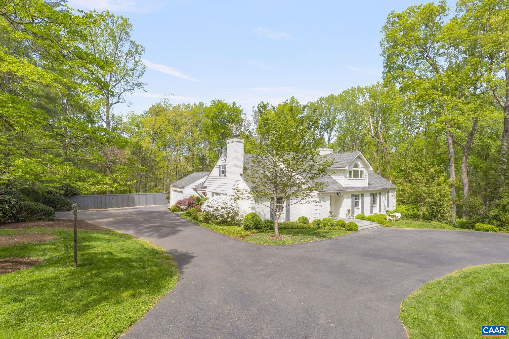 It has it all. In Flordon, this is a substantial home of five bedrooms and 5,415 square feet on a gorgeous lot, complete with thoughtful landscaping, natural privacy, a heated pool, and a brand new screened-in pool pavilion. The main floor features one of two potential primary suites, a proper office, a formal dining room, a beautiful living room with views across the back of the property, and the heart of the home: a gourmet kitchen with a large, custom-built island, premier appliances, and a sitting area with a fireplace. Upstairs, there are four bedrooms, including the other primary suite. The basement features a bar, exercise room, and theater with stadium seating. There are two garages and ample room for storage. A convenient mud room keeps everything organized and tidy, adding to the home's thoughtful design. Outside, a private oasis awaits. Entertain in style on bluestone patios in the middle of lush landscaping, a stone’s throw from the pool. The new pavilion elevates the experience with a resort-style feel, ideal for hosting throughout the year, rain or shine. From the impressive interiors to the outdoor retreat, every detail of this home speaks to quality, comfort, and timeless appeal.