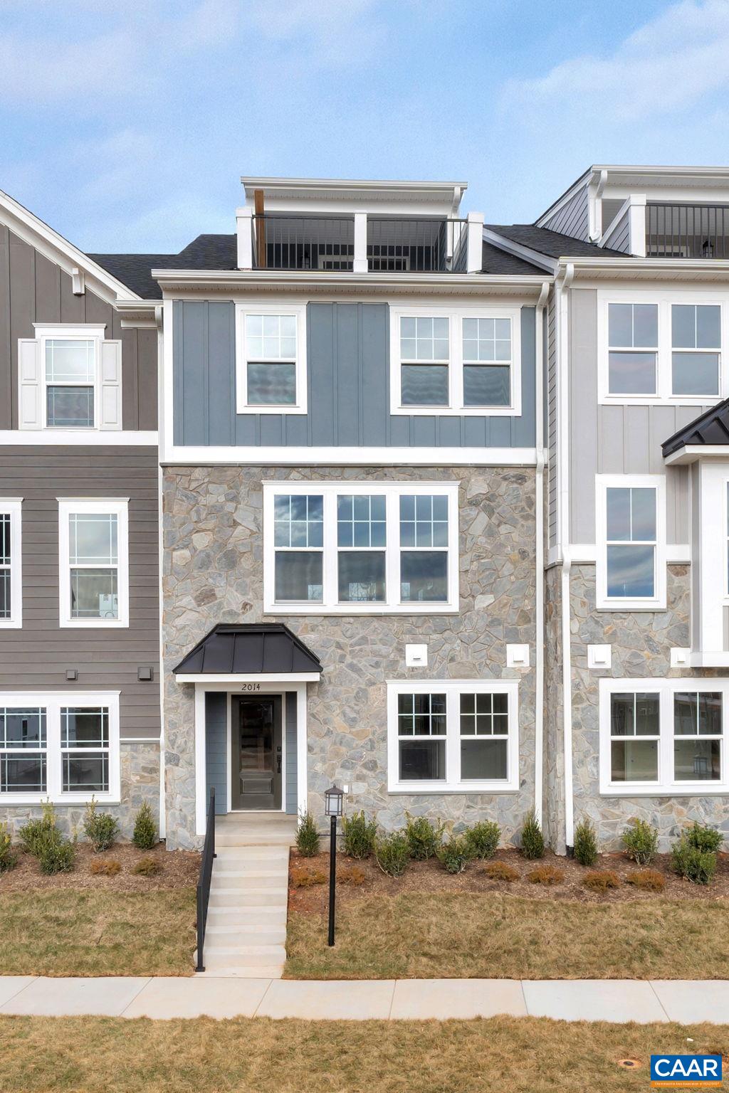 Under construction for a Late Summer '25 completion! The Poplar II Townhome in Glenbrook, set among Blue Ridge Mountain views, parks and walking trails, yet minutes from downtown Crozet. This earth-friendly, farmhouse-style interior townhome will undoubtedly wow you – from the fresh architecture featuring real stone, the generously sized kitchen and walk-in pantry offering both ample storage + prep space, elevated rear deck perfect for sipping your morning coffee, and first floor bedroom with full bathroom perfect for guests or a flex space! The 4th level features a loft and rooftop terrace overlooking the Blue Ridge Mountains. Thoughtful and quality included features throughout, including a 2-car attached garage, oak stairs, solid core doors, wood shelving, upgraded trim, energy efficient furnace, the list goes on. Walking Path to Crozet Park and future direct access to Downtown Crozet. Photos are of a similar home and may show optional or upgraded features.