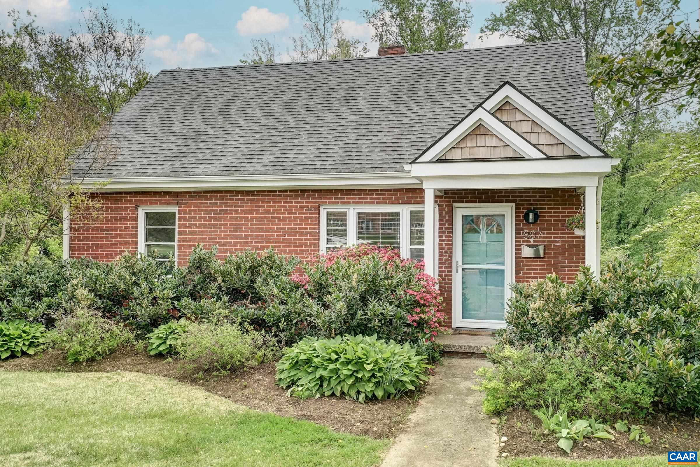 Wow! Updated North Downtown home with fresh paint, updated kitchen and bathrooms on .3 acres is walkable to the Downtown Mall, McIntire Park and Rivanna Trails. Hardwood floors in the living, dining room and bedrooms on the main level sparkle in the fresh paint, and light filled rooms. Updated kitchen features new stainless steel refrigerator (2023) updated stainless appliances, tile backsplash, and maple cabinets.  Vaulted dining room is an addition (2010) that makes a great light-filled living space and provides access to the spacious deck.  Two bedrooms and a full bathroom complete the main level.  Upstairs, two large bedrooms both feature built-in storage and share a full bathroom with tub/shower combo. Full walk-out basement features a large rec space, laundry area and storage room. Flat back yard offers off-street parking for multiple cars, room to play, and a 240sqft storage shed. Don't miss this Charlottesville home!