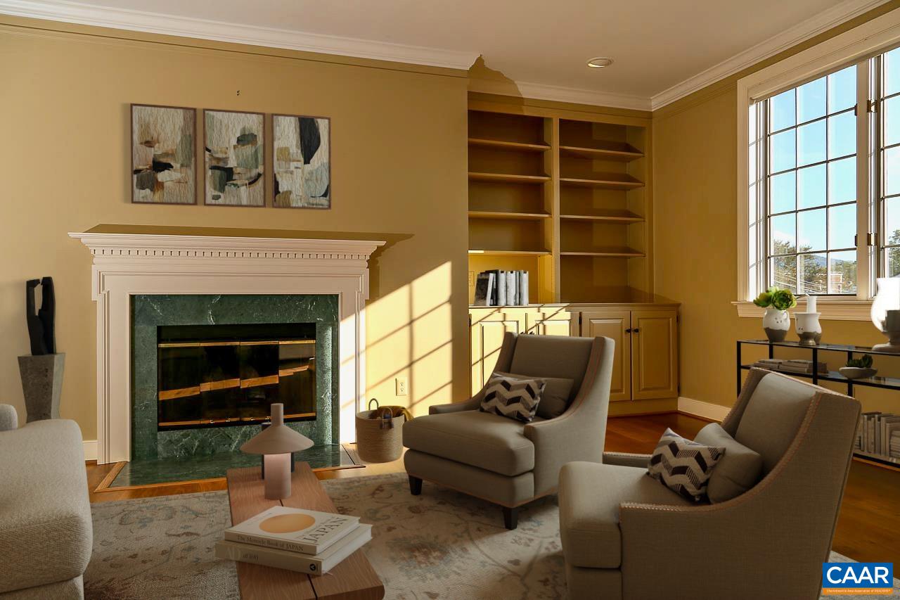 Enjoy everything Downtown Charlottesville has to offer from this prime location on East Jefferson Street only 2 blocks from the Downtown Mall with restaurants, theaters, art openings, and open air concerts all within walking distance. From the balcony you have a panoramic view of historic downtown buildings, churches, and homes and Market Street Park. Renovated interior has hardwood floors, updated kitchen and baths, stainless appliances and quartz counters. Full size kitchen has plenty of counter and cabinet space, a nice pantry, and room for a breakfast table. Open floor plan makes the living area feel spacious. South facing windows and balcony let in lots of sunshine into this upper floor unit. Full size washer and dryer in the hall laundry room convey. Enjoy the safety of a secured building and a covered parking space reserved for you in the ground floor garage. Take the stairs for exercise or use the elevator. Each unit has a generously sized, locked storage area in the basement for sports equipment or suitcases or seasonal items, etc.  Condo fee covers water/sewer, gas service for the FP along with all maintenance of the building, exterior grounds, & interior common spaces. Both Ting & Xfinity high speed internet available.