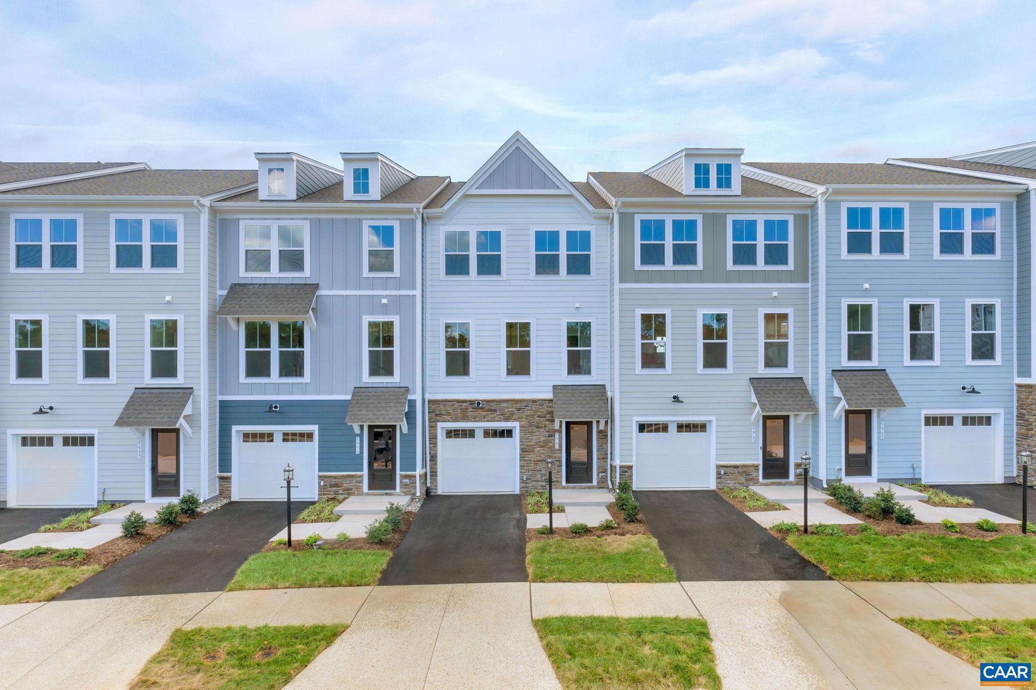 Looking for a home with convenience and walkability, but still want a sense of privacy? This Downtown Crozet Townhome has no other homes behind it. Spread out in the entry-level Rec Room with a half bath and access to a backyard you can fence. The open concept Main Level is anchored by a 10’ white quartz Kitchen Island. Stainless Steel GE® Appliances and durable LVP flooring bring style and functionality. The wide Living Room has plenty of space for lounging and opens to a private 10’X17’ Deck, perfect for hosting friends or relaxing solo. Side-by-side Laundry is on the Bedroom Level by a large linen closet, Full Bath, and three Bedrooms. The Primary, with a walk-in closet and double-vanity Bath, gets great light and easily fits a King Bed. Take things off your To-Do List with HOA covered lawn mowing, warranty coverage, and low-maintenance finishes. Use the extra time to go out and play! The central location offers an easy drive to all things outdoors, like hiking at Mint Springs, kayaking at Beaver Creek, or picnicking at King Family Vineyards. Invite friends to hang out at the firepits, book a private event at the clubhouse, or frolic on the playgrounds. Photos from previously built homes. Estimated September completion.