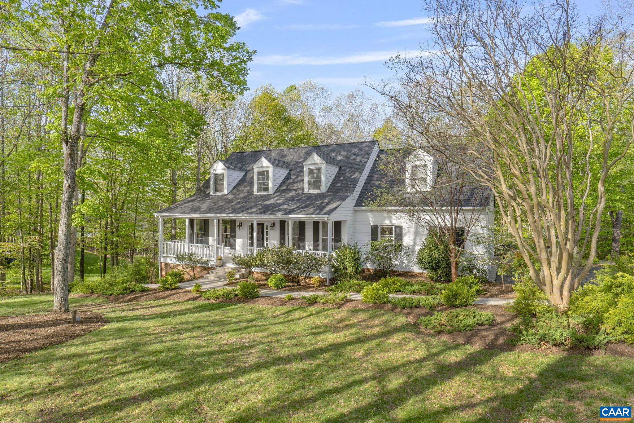 Welcome to this meticulously maintained 4-bedroom, 3.5-bath Cape Cod-style home in the desirable Glenmore community. Set on a nearly level, beautifully landscaped lot with mature trees, this home offers an exceptional blend of indoor comfort and outdoor living. Enjoy your morning coffee on the large covered front porch, unwind with a book on the peaceful screened-in porch, or host guests on the spacious back deck or patio by the firepit. The fenced yard and curated gardens create a private retreat perfect for relaxation and entertaining. Inside, the main level features generous living areas filled with natural light. The fully finished basement expands the home’s versatility with a large rec room, bonus room, full bath, and a plumbed-in area ready for a kitchenette—ideal for guests, multi-generational living, or a home office setup. The oversized garage offers ample space for a workshop or extra storage. All of this just 15 minutes from Charlottesville, with access to Glenmore’s premier amenities including scenic golf course, tennis courts, swimming pool, clubhouse, equestrian center and walking trails. A rare opportunity to enjoy quiet elegance and convenience in one of Central Virginia’s most sought-after gated communities!