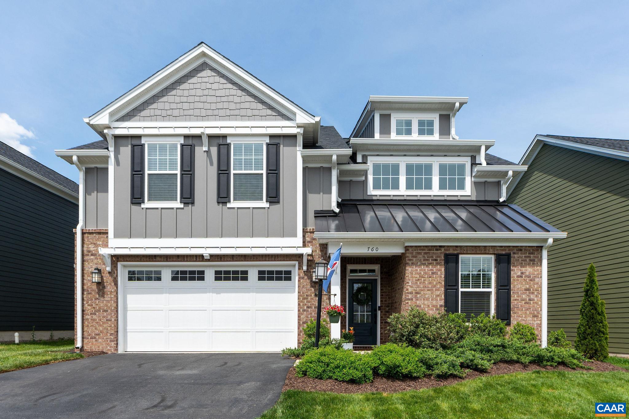 This thoughtfully designed open-concept home blends comfort, style, and modern functionality. The main level centers around a spacious kitchen that flows seamlessly into the dining area and family room-ideal for entertaining and everyday living. Additional features on the main floor include a private office, a generous walk-in pantry, and a convenient mudroom with built-in storage for a tidy drop zone. Upstairs, a dramatic loft with a soaring two-story ceiling and stacked windows fills the space with natural light, creating the perfect setting for a secondary living area, playroom, or additional office. The home offers four well-appointed bedrooms, including a luxurious owner’s suite with a spa-like shower, an oversized walk-in closet, and the convenience of a connected laundry room. Two of the 3 secondary bedrooms also feature walk-in closets, providing ample storage throughout. The kitchen showcases designer finishes including stunning tile backsplash, sleek hood, quartz countertops, and a walk-in pantry. Custom upgrades throughout the home include elegant wainscoting, stylish light fixtures, and bold accent walls that elevate each space. With quick access to the Crozet Trail System and Crozet Park the location can't be beat!