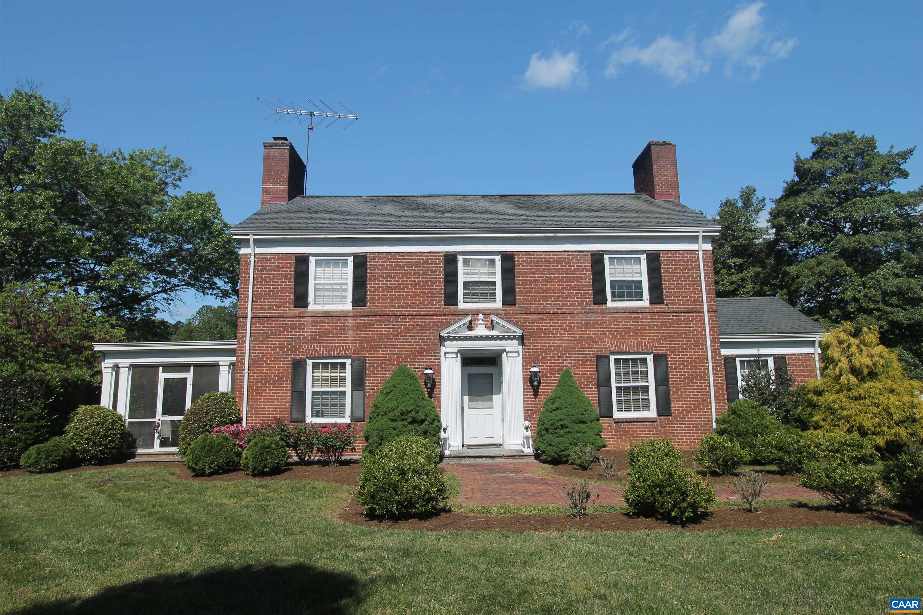 Out of Bounds is a stately brick residence that offers an exceptional blend of location, privacy, and timeless character. Nestled on beautifully landscaped grounds, this classic two-story Virginia home was built in 1940 and features nearly 3,000 finished square feet of refined living space.  The gracious interior showcases high ceilings, generously proportioned rooms, and extensive custom wood trim throughout. With stunning views of the manicured grounds, the home provides both elegance and comfort—ideal for entertaining or everyday living.   Additional highlights include a charming screened-in porch, a detached garage with carport, and mature gardens accented by brick and stone walkways. The property offers remarkable privacy while enjoying the convenience of an in-town location—and may also include possible division rights.   This is a rare and wonderful offering—an ideal opportunity to own a distinctive home in one of the area’s most desirable locations.