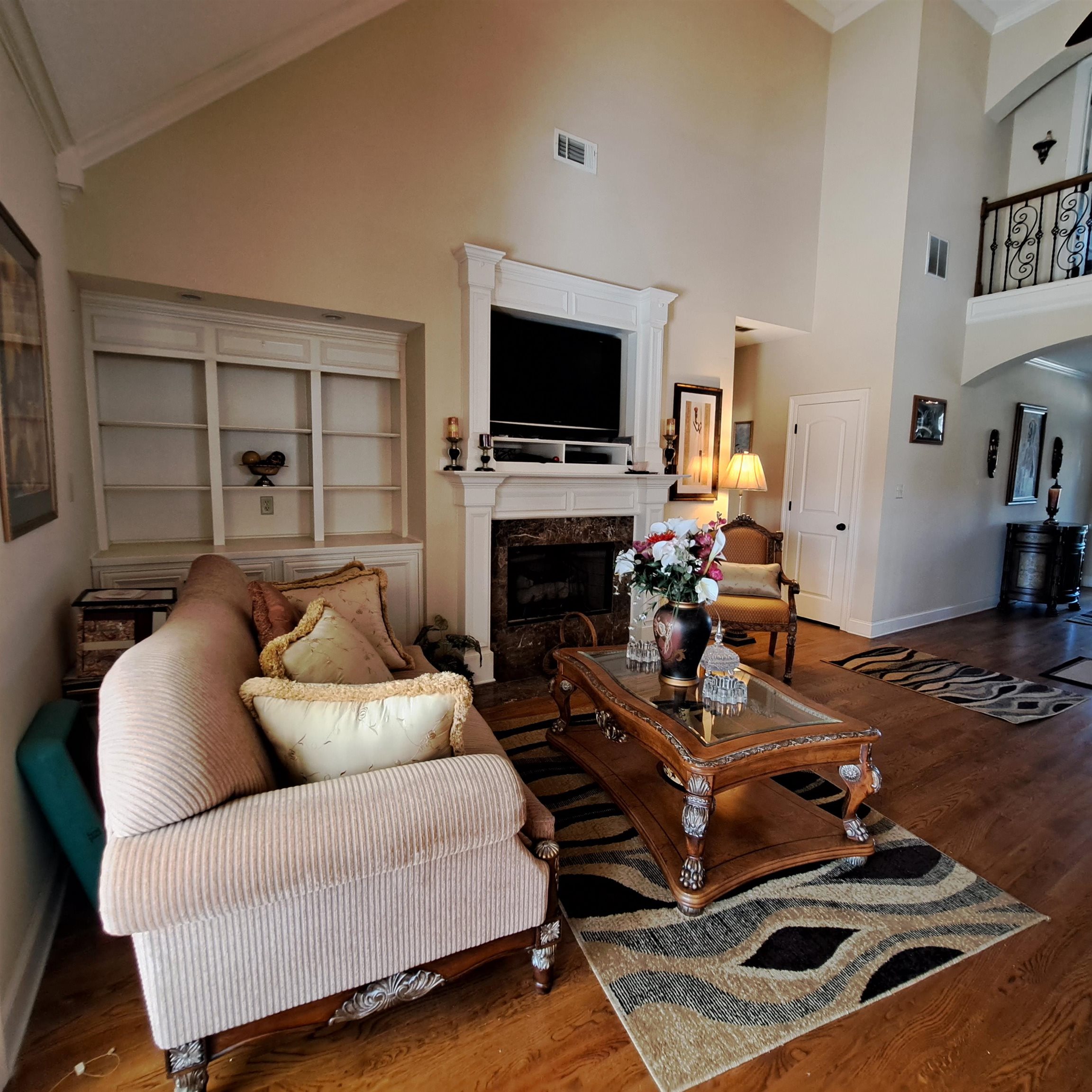 Spacious Great Room all open to keeping room and kitchen.  All your family or guests in one area.  Rear entrance to large covered patio.  Stunning view of the park like backyard.