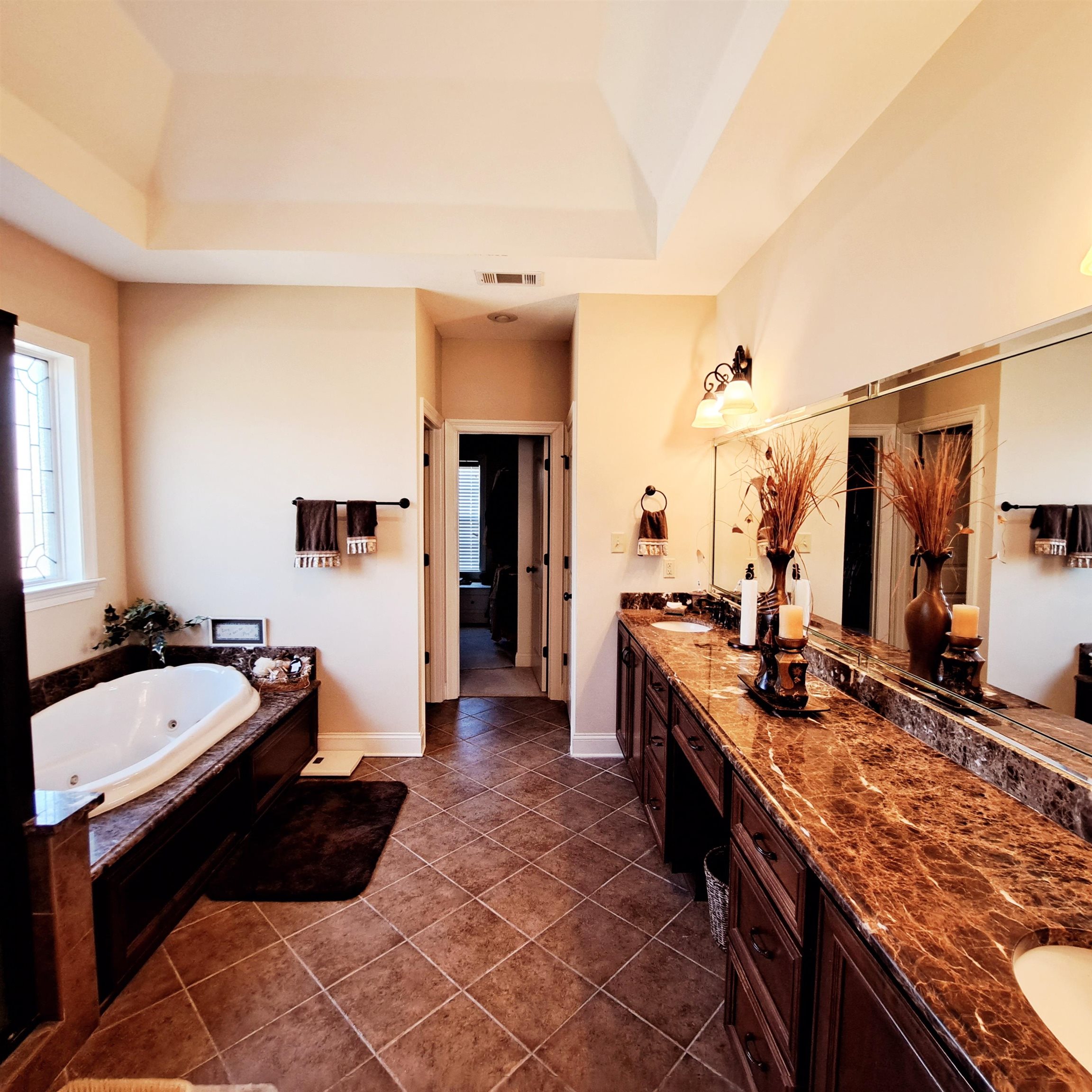 Custom design with tons of storage cabinets and drawers.  Beautiful tile shower.