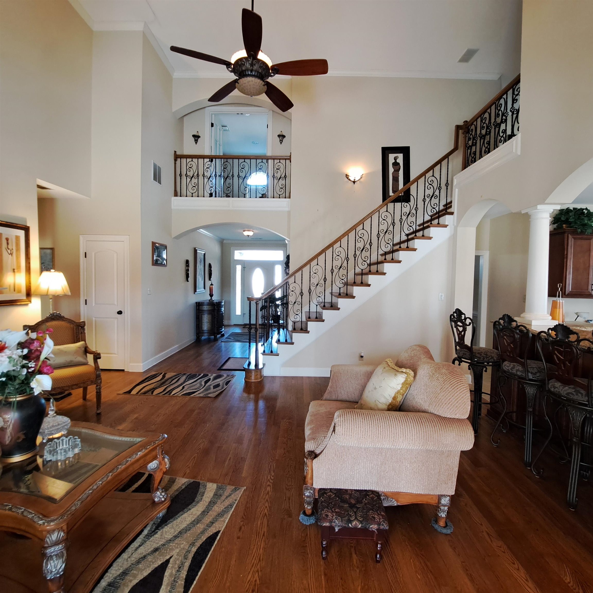 Hardwood flooring with columns at the formal dining room entry.