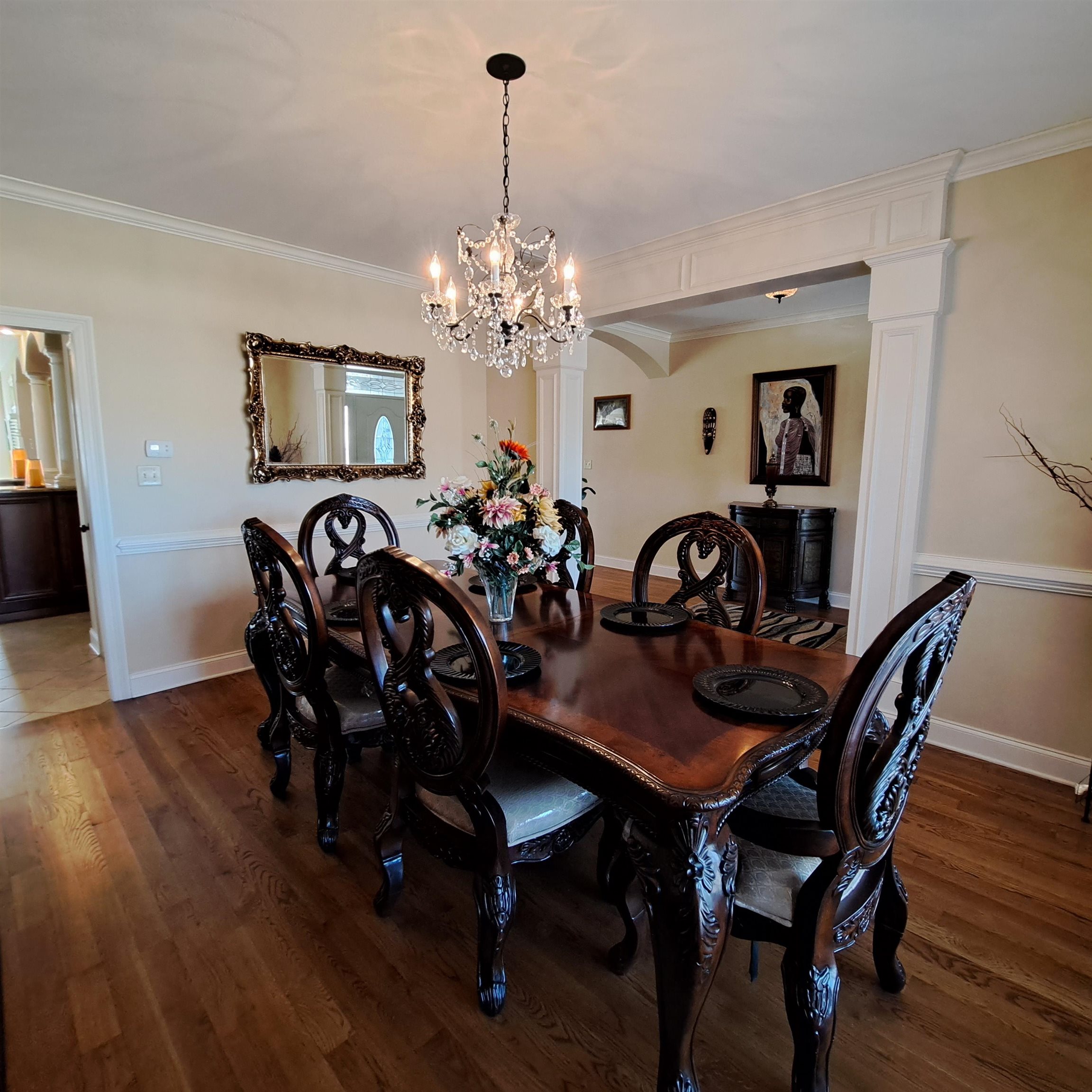 Plenty of room for your large dining room furniture.  Hosting holiday meals, or private dinner parties give you plenty of room for you and your guests.  Gorgeous light fixture situated over the dining room table.