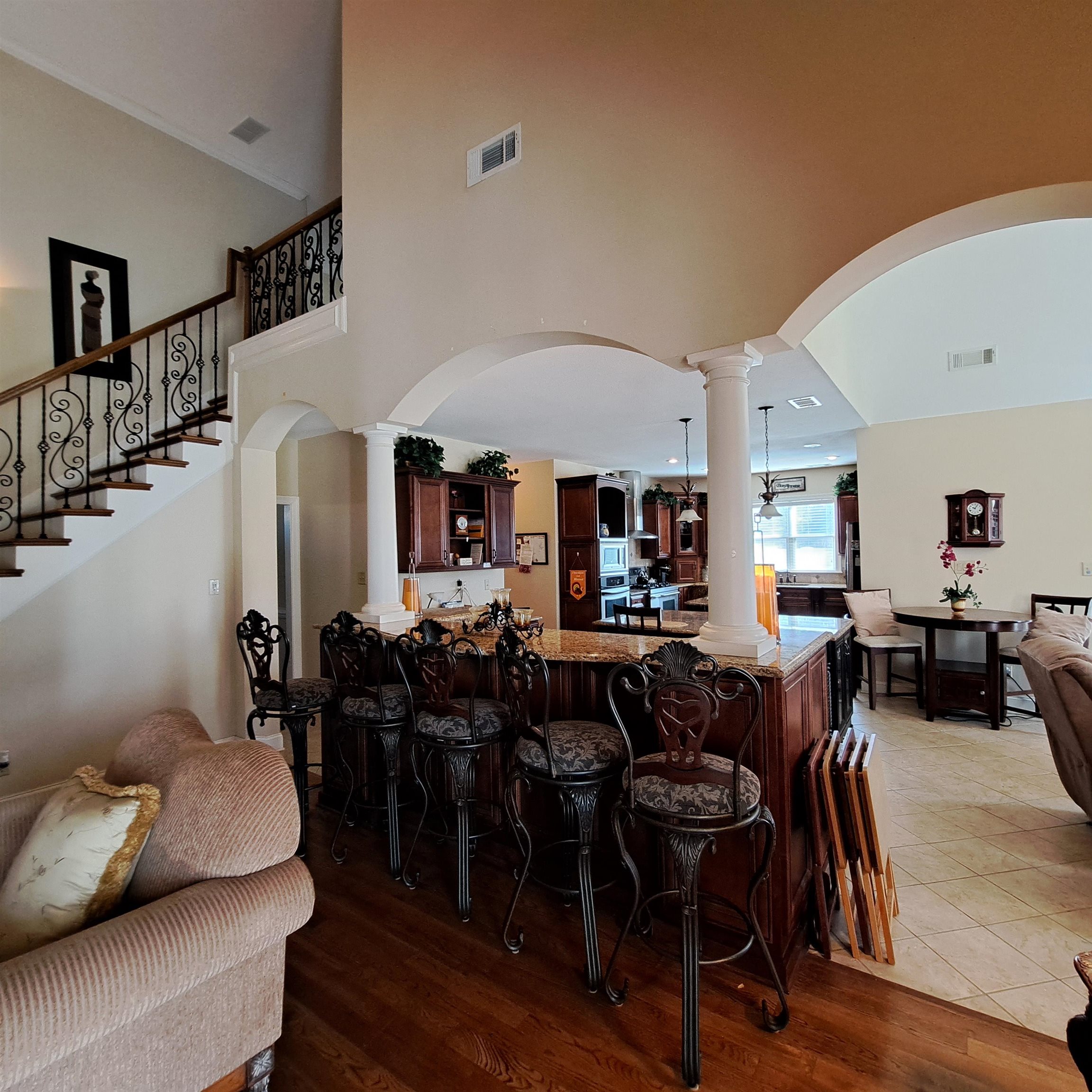 Stunning entry to the open Great Room, Keeping Room and Kitchen.  All open with columns, smooth ceilings, Fireplaces in Keeping Room and Great Room.
