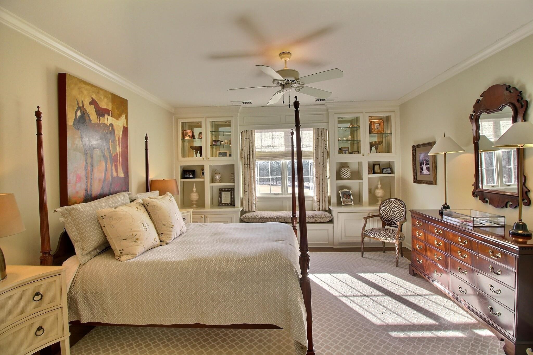 Beautiful view of the tree-lined drive. Custom built-ins.