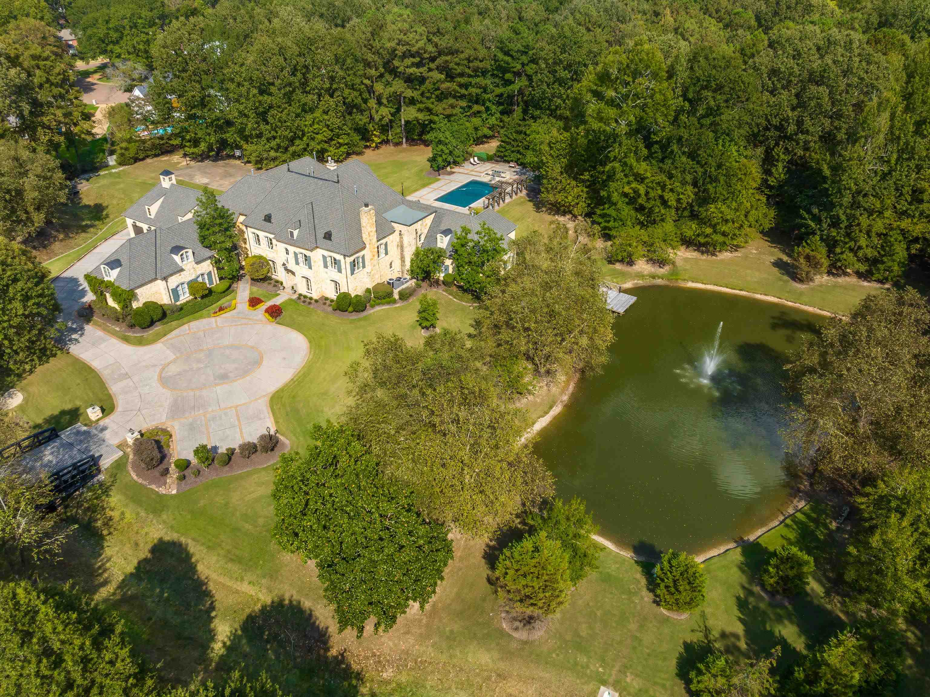Extremely Rare Opportunity to own a 9+/- acre ultra-private, gated Germantown estate w/pool, endearing pond, generator, & even platted for a second home on the property. Features incl beamed entry w/floating spiral staircase, world class primary kitchen + caterer's kitchen w/Wolf appls, FPs in the LR, GR, & porch, spacious primary suite w/soaking tub & frameless glass shower, 36x25 gym w/16' ceil, media rm, 40’x23’ vaullted, beamed scrn cooking porch, pool & hot tub, pond w/fountain, & more.