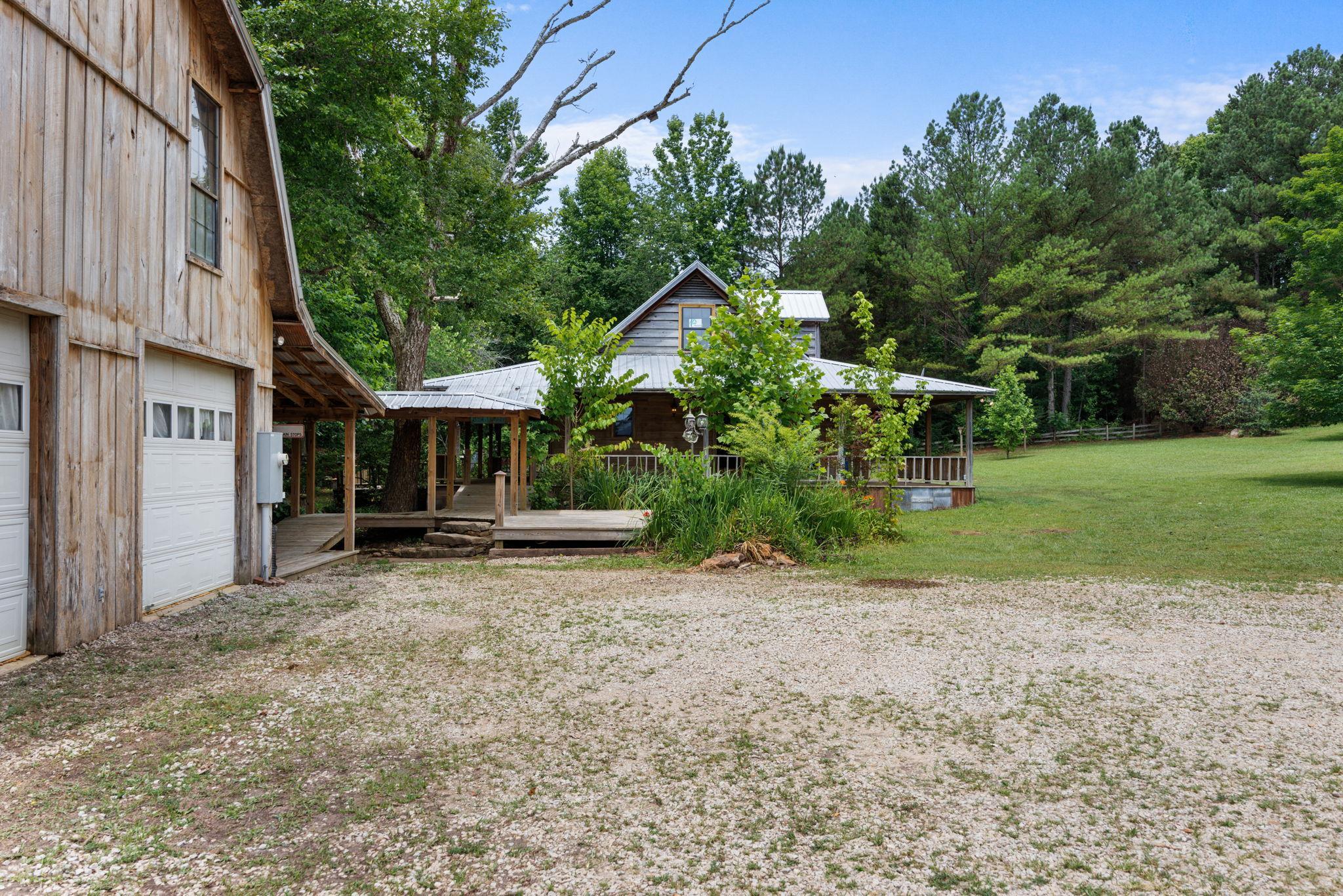 View of yard featuring a wooden deck and a gazebo