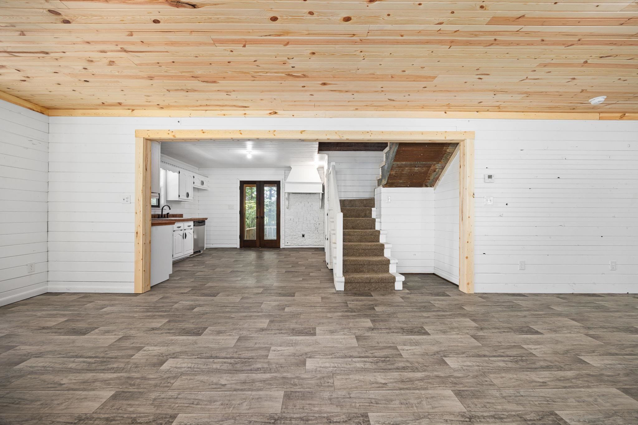 Interior space featuring tile flooring and wood ceiling