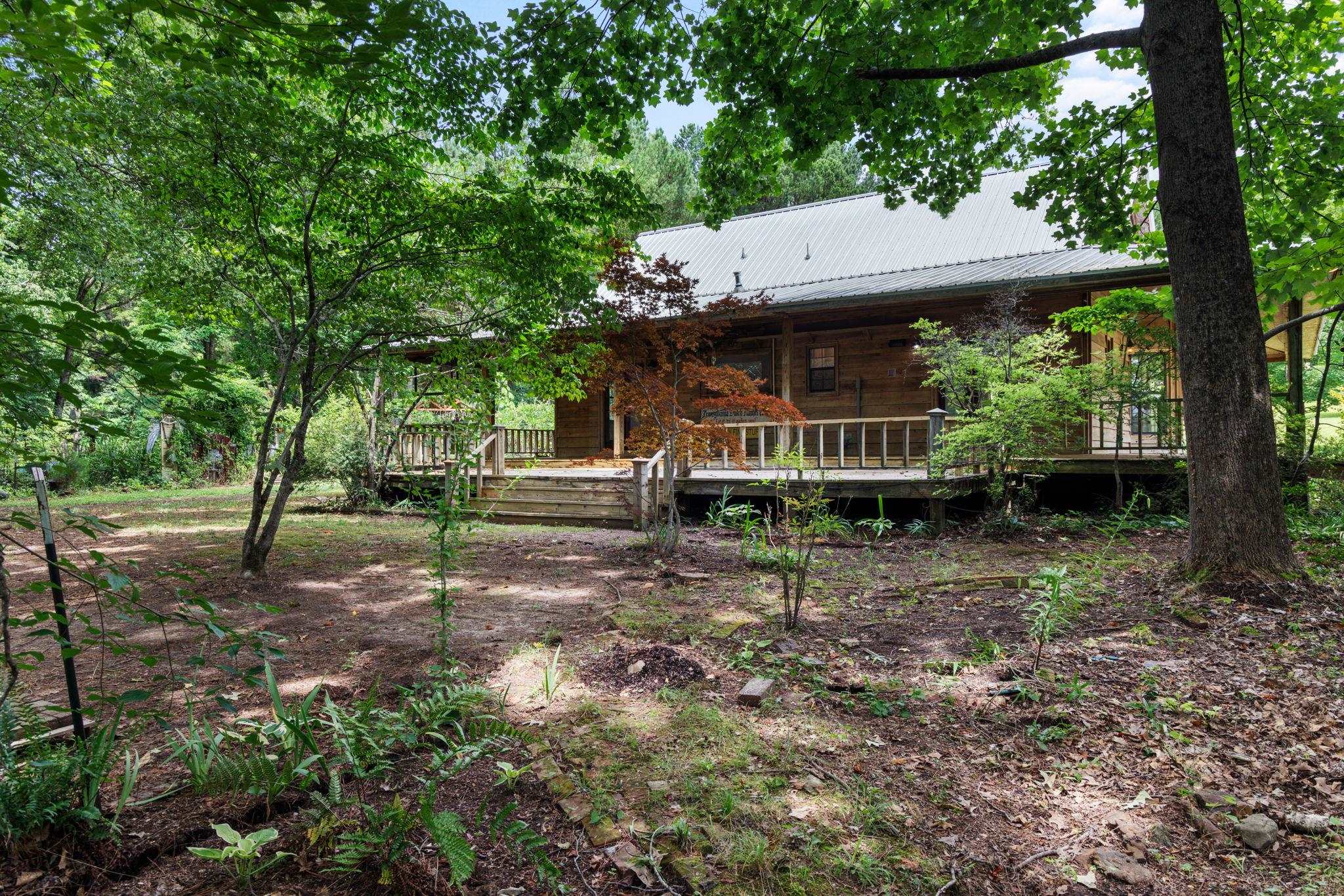 View of yard with a wooden deck