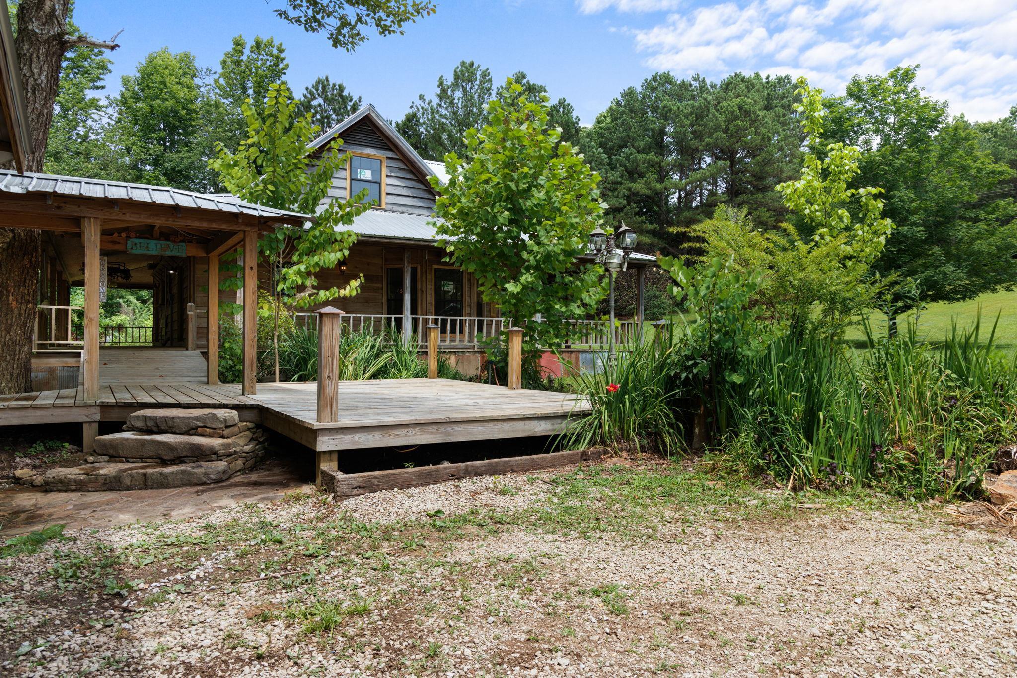 View of yard with a wooden deck