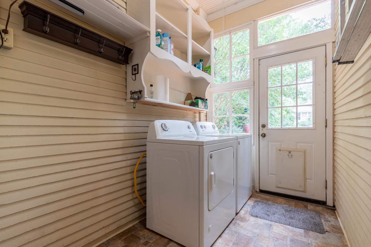 Laundry room/mudroom opens from deck and back hall.