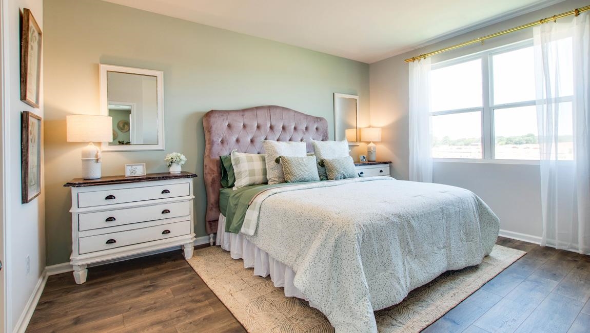 Bedroom with hardwood / wood-style floors