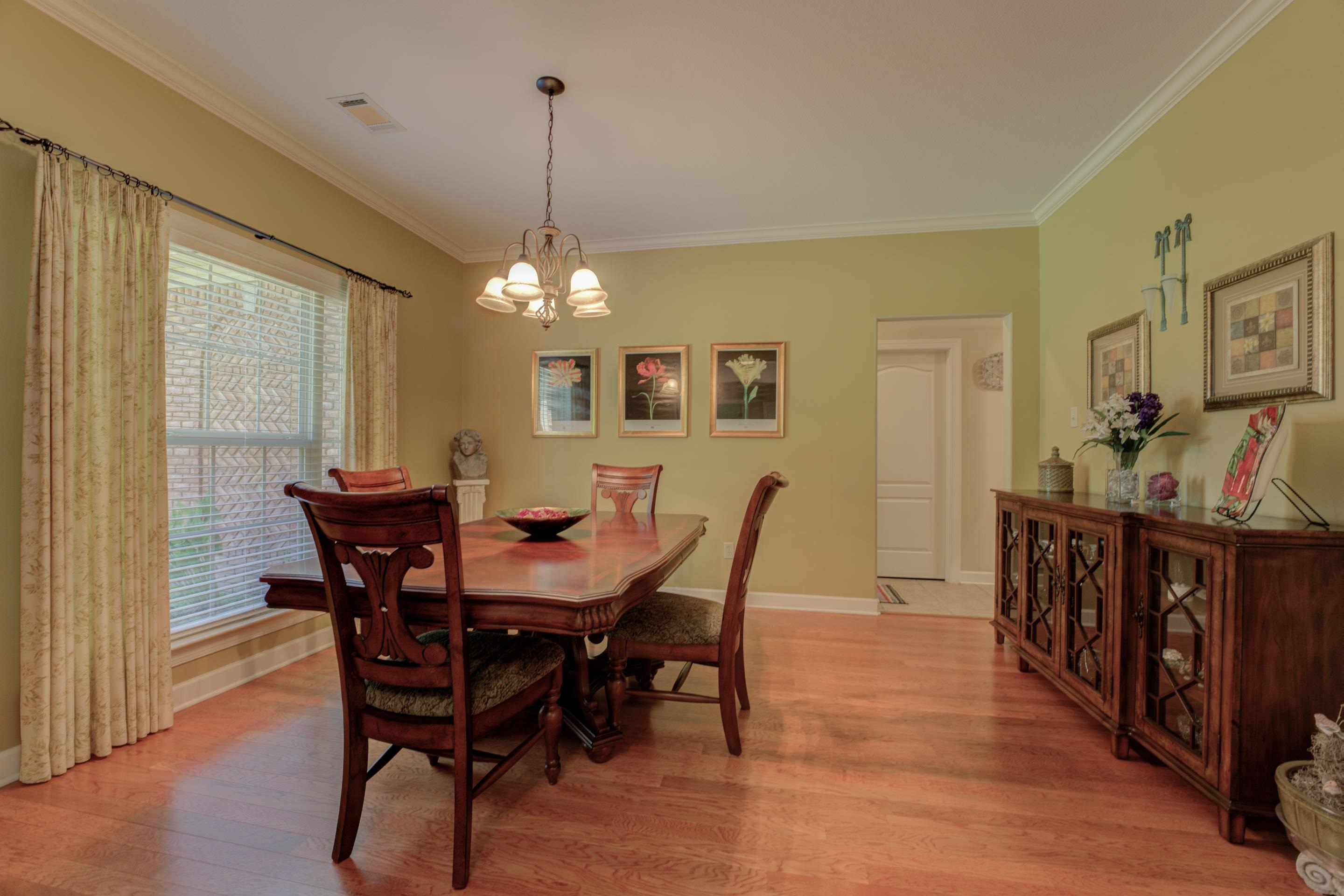 Large Dining area featuring hardwood / wood-style floors, a chandelier, and crown molding, Room for Your Guest!