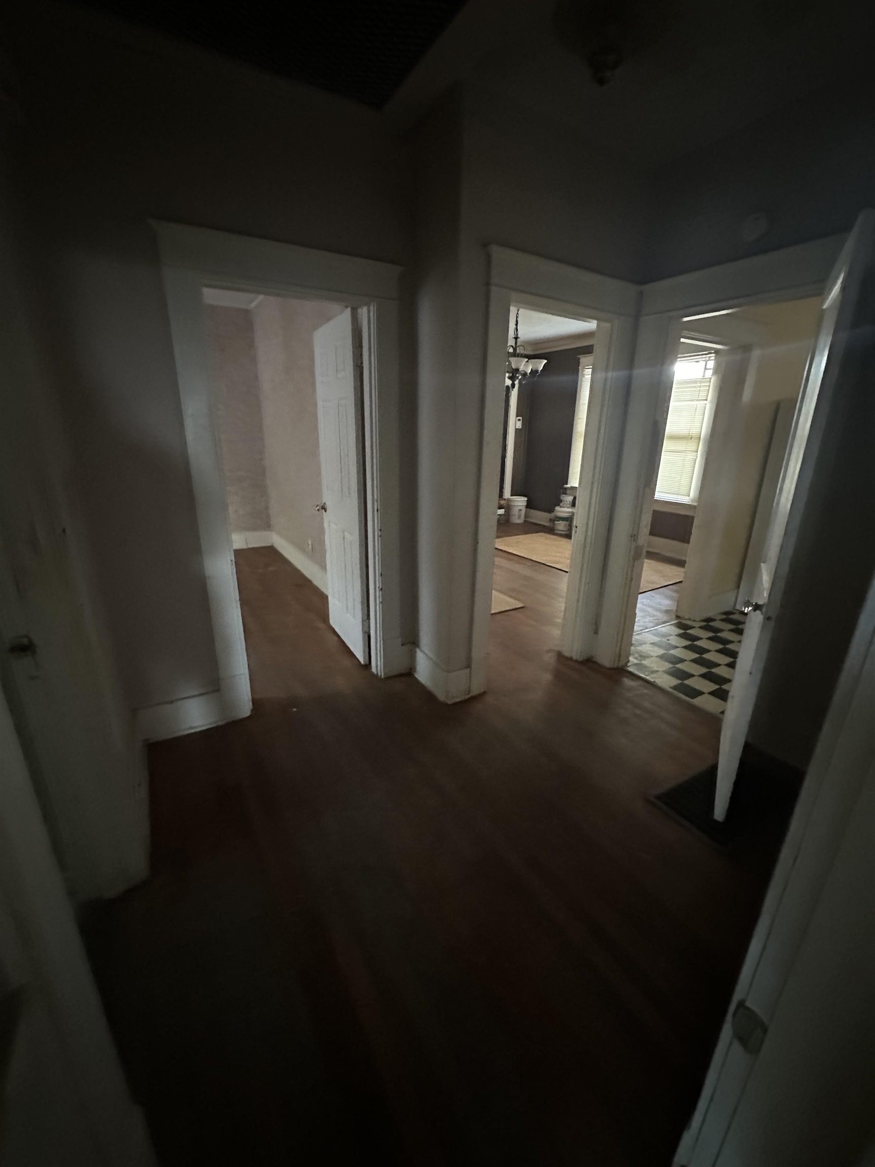 Corridor with hardwood / wood-style floors