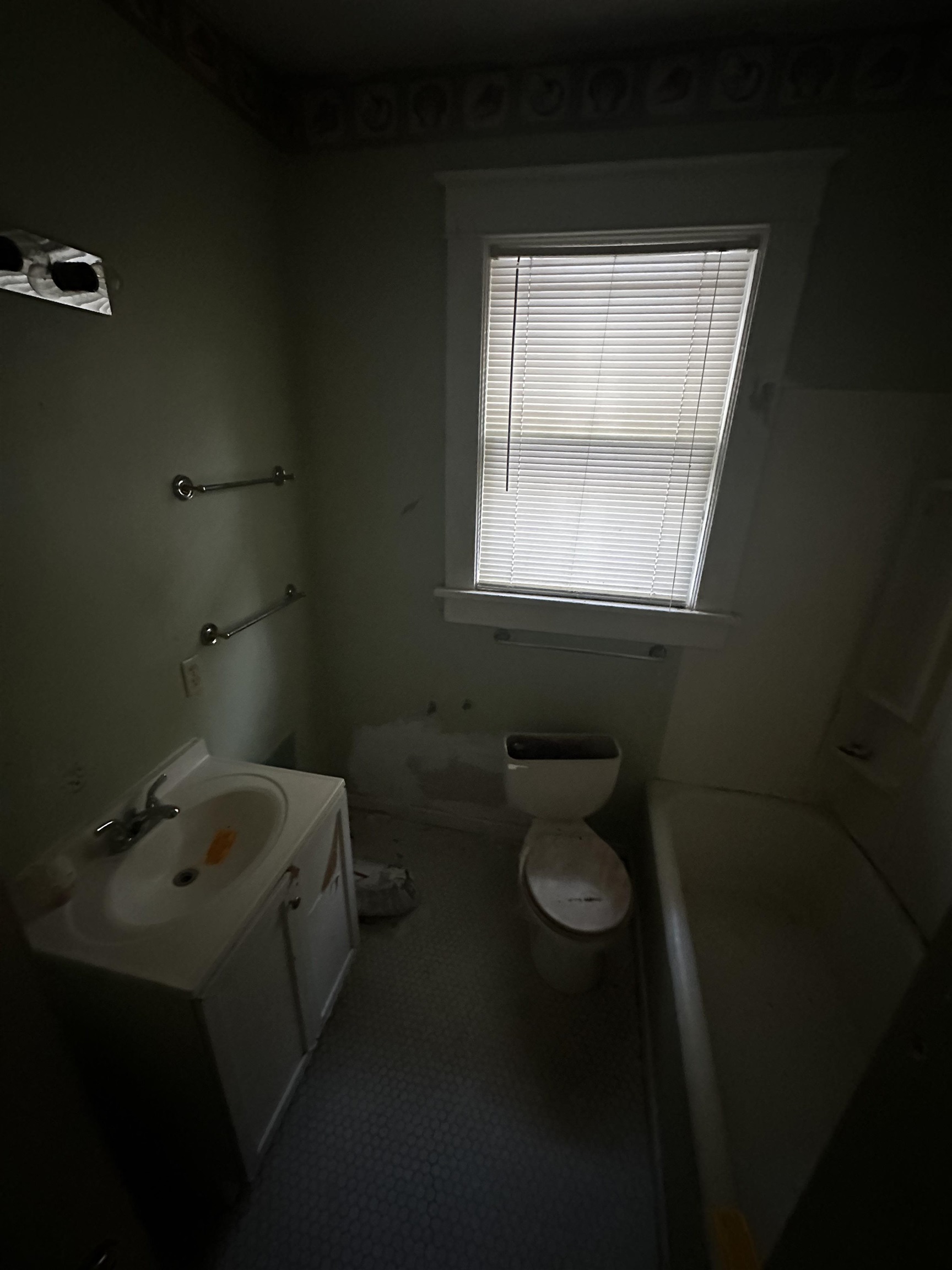 Full bathroom featuring tub / shower combination, vanity, and toilet