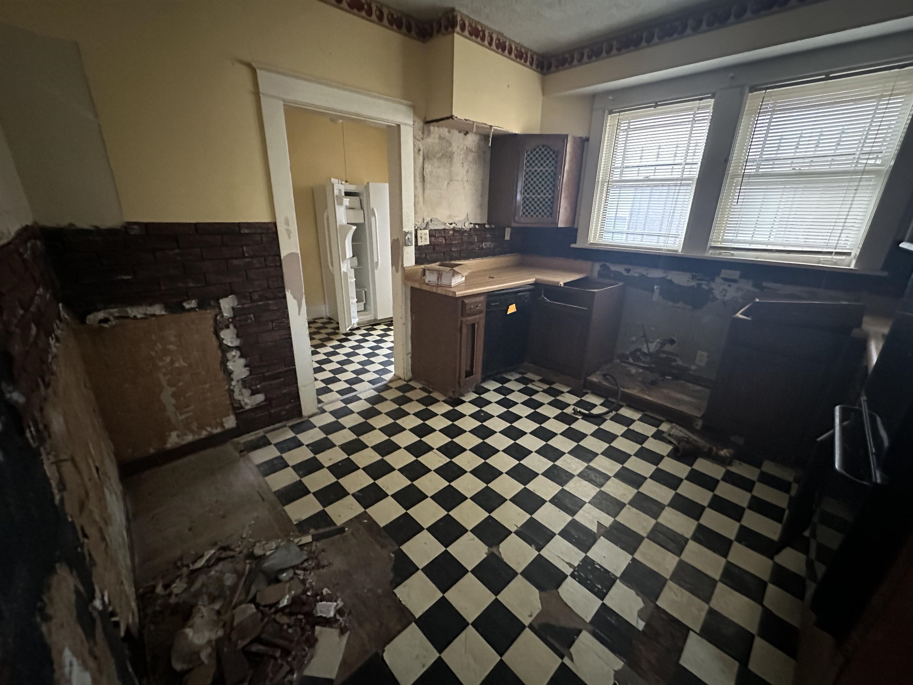 Kitchen with dark tile floors