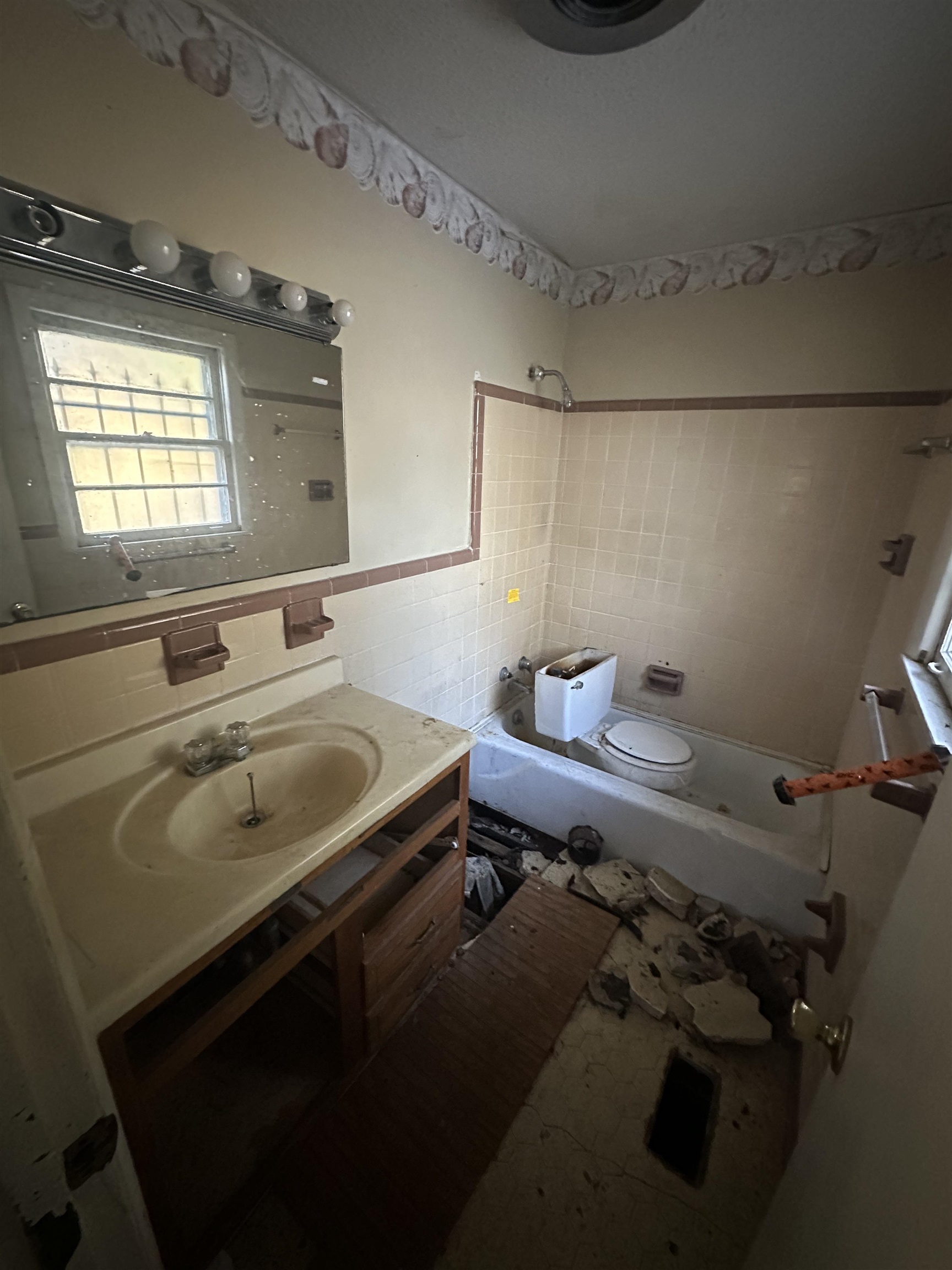 Bathroom featuring tile walls and vanity