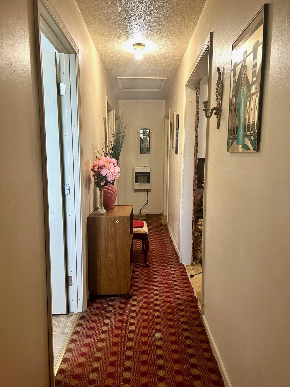 Hallway with a textured ceiling