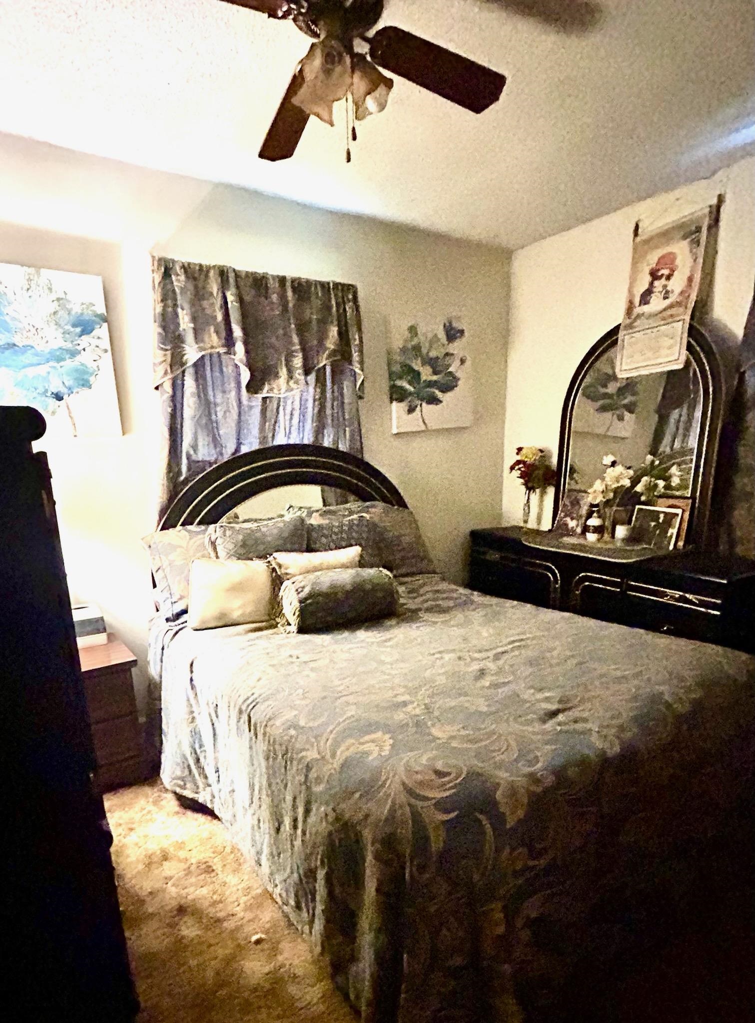 Bedroom featuring ceiling fan