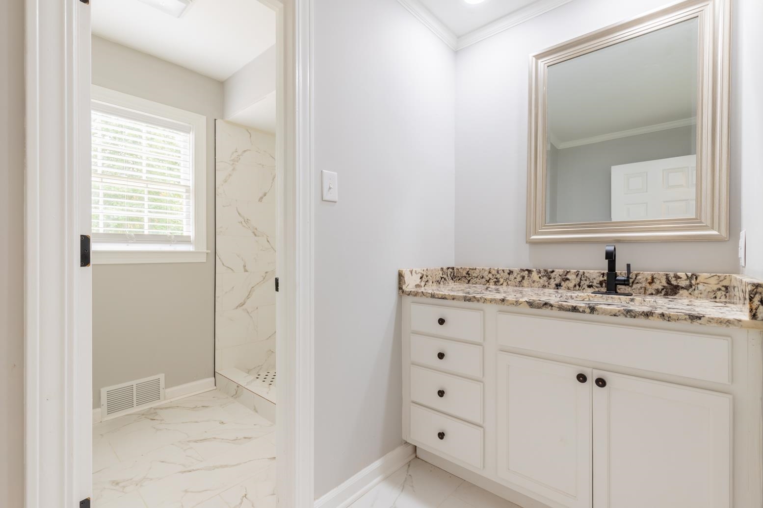 Bathroom featuring tiled shower