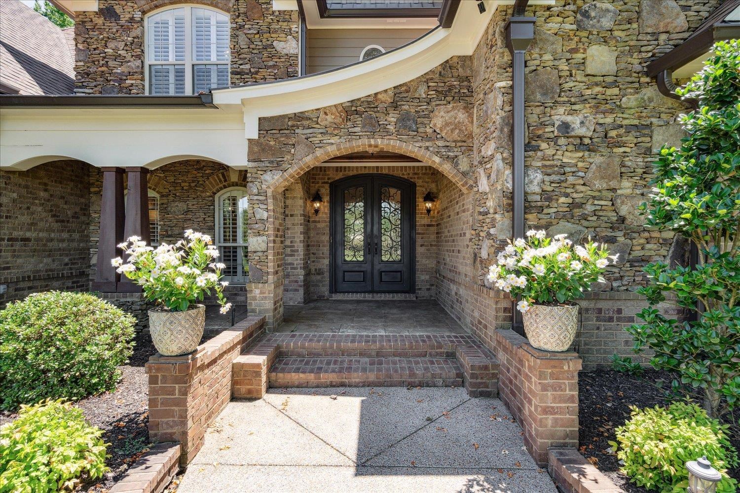 Stacked Stone arched entry, AR Fieldstone front porch