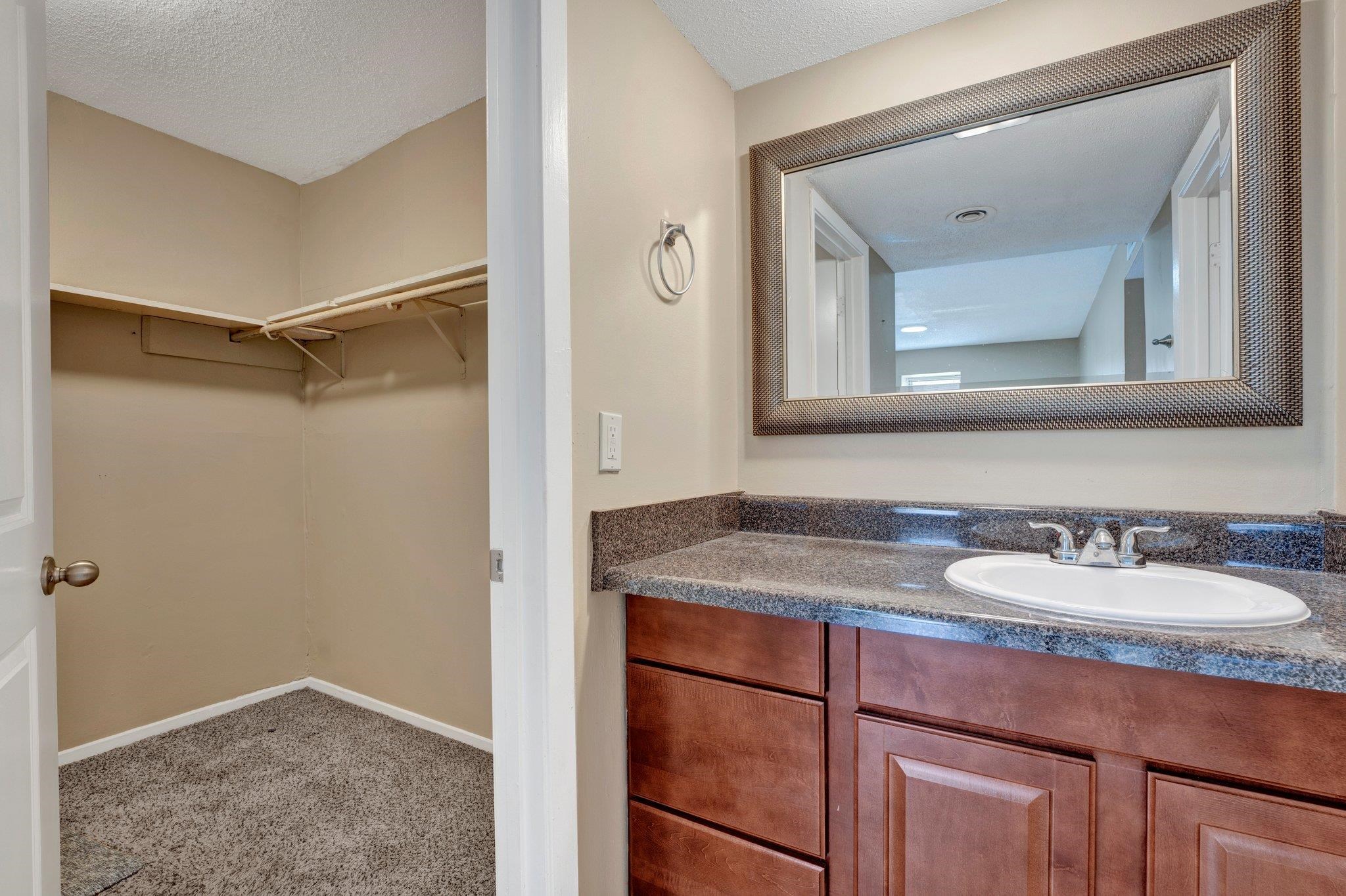 Bathroom featuring vanity and a textured ceiling