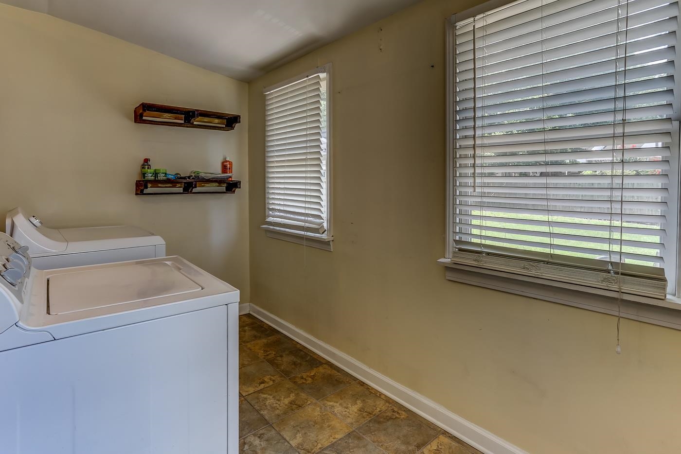 Yes! A dedicated laundry room is so much better than having it in the kitchen, and tough to find for the area!