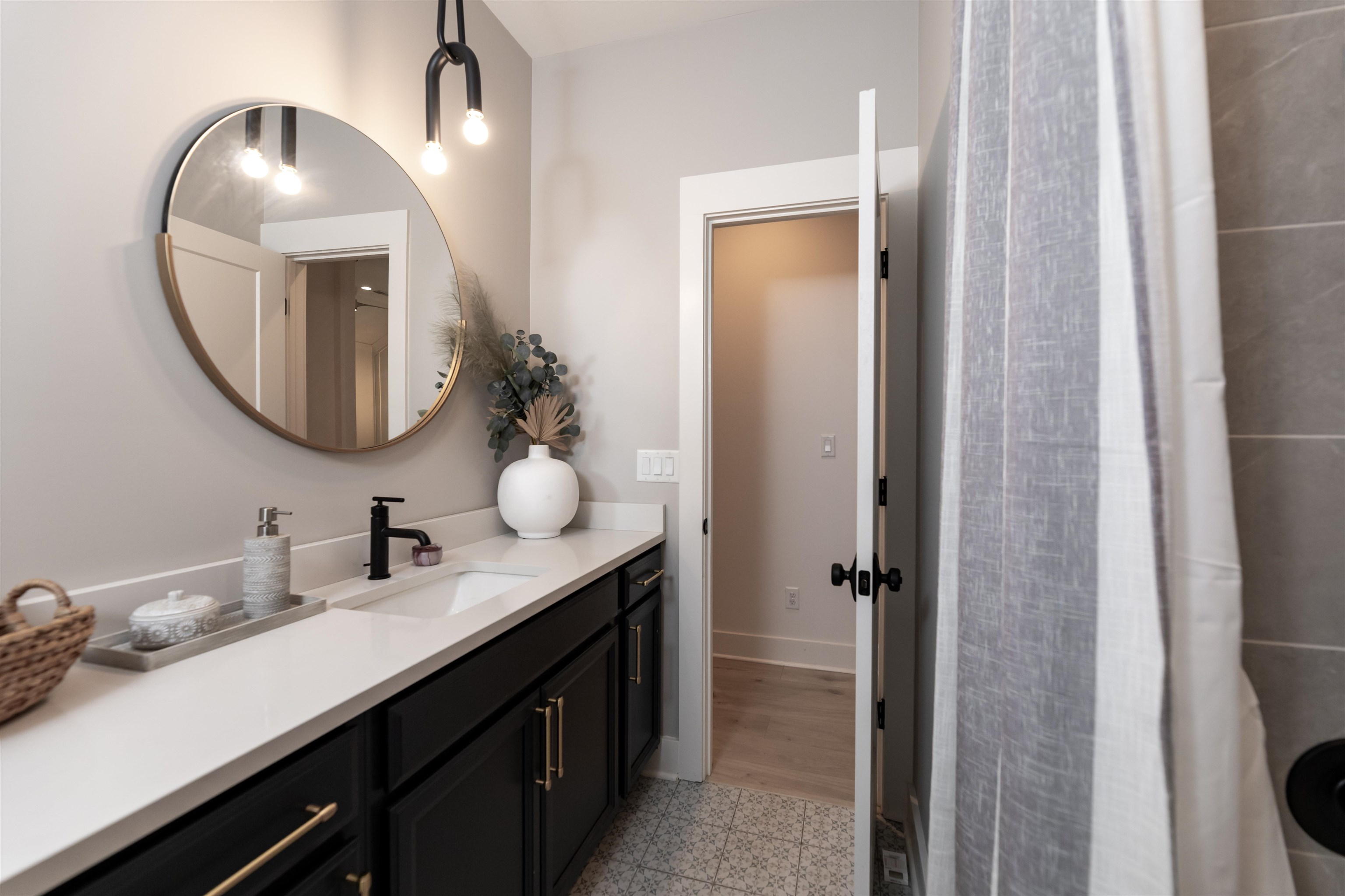 Bathroom with tile flooring and vanity