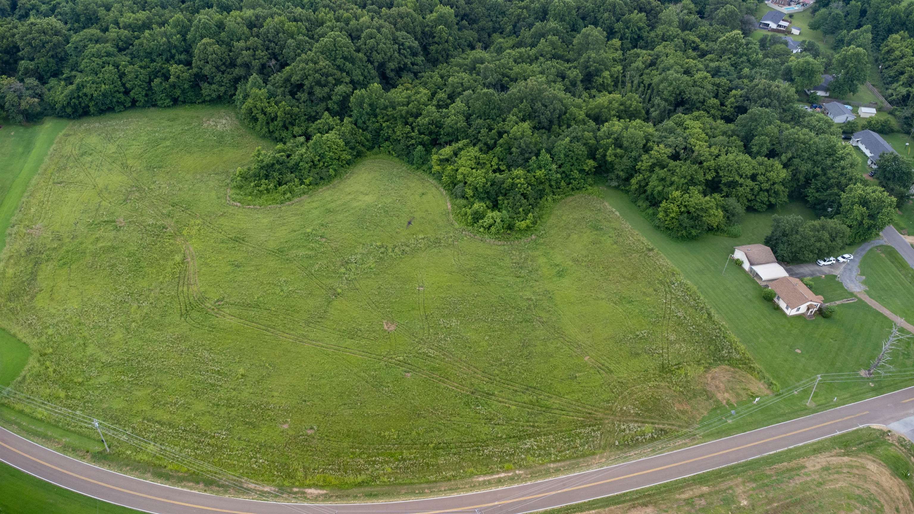 Birds eye view of property with a rural view