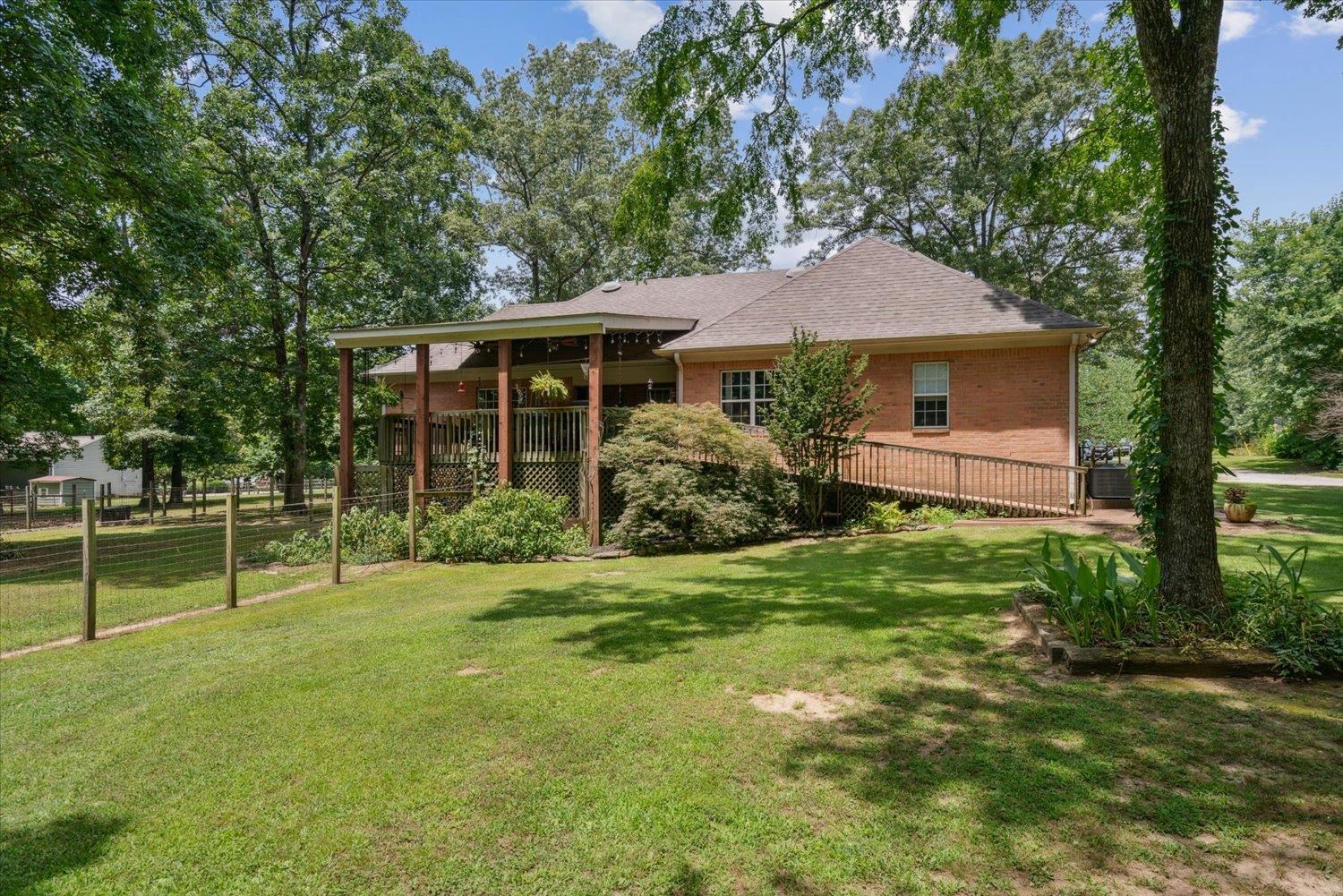 Rear view of property featuring a yard