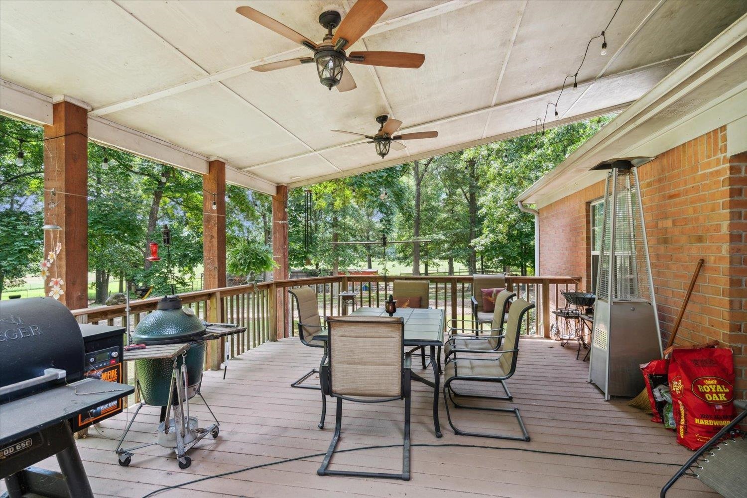 Wooden terrace featuring ceiling fan