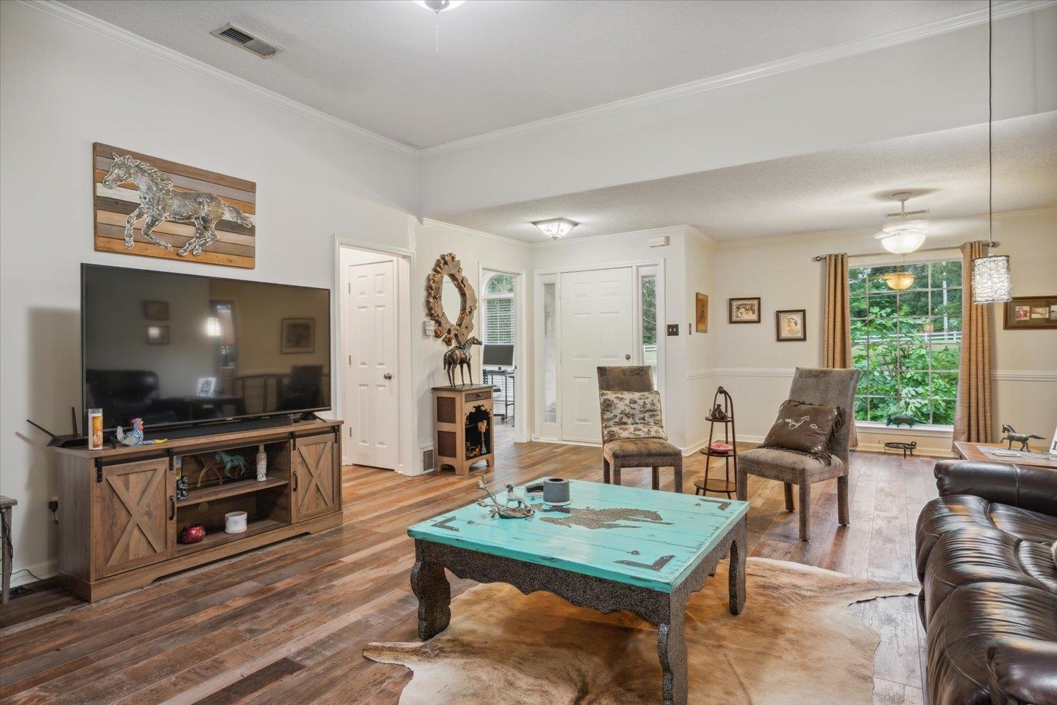 Living room with hardwood / wood-style flooring